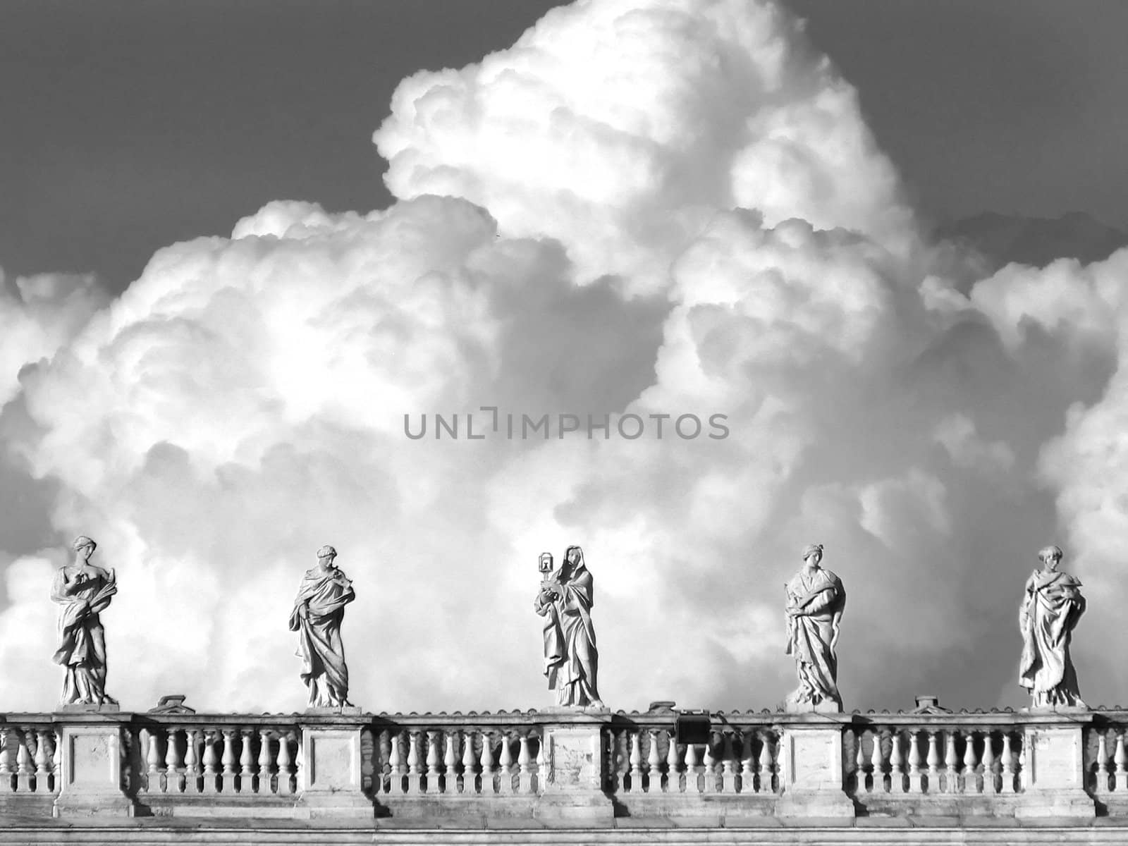 statues in s.pietro in rome whit clouds