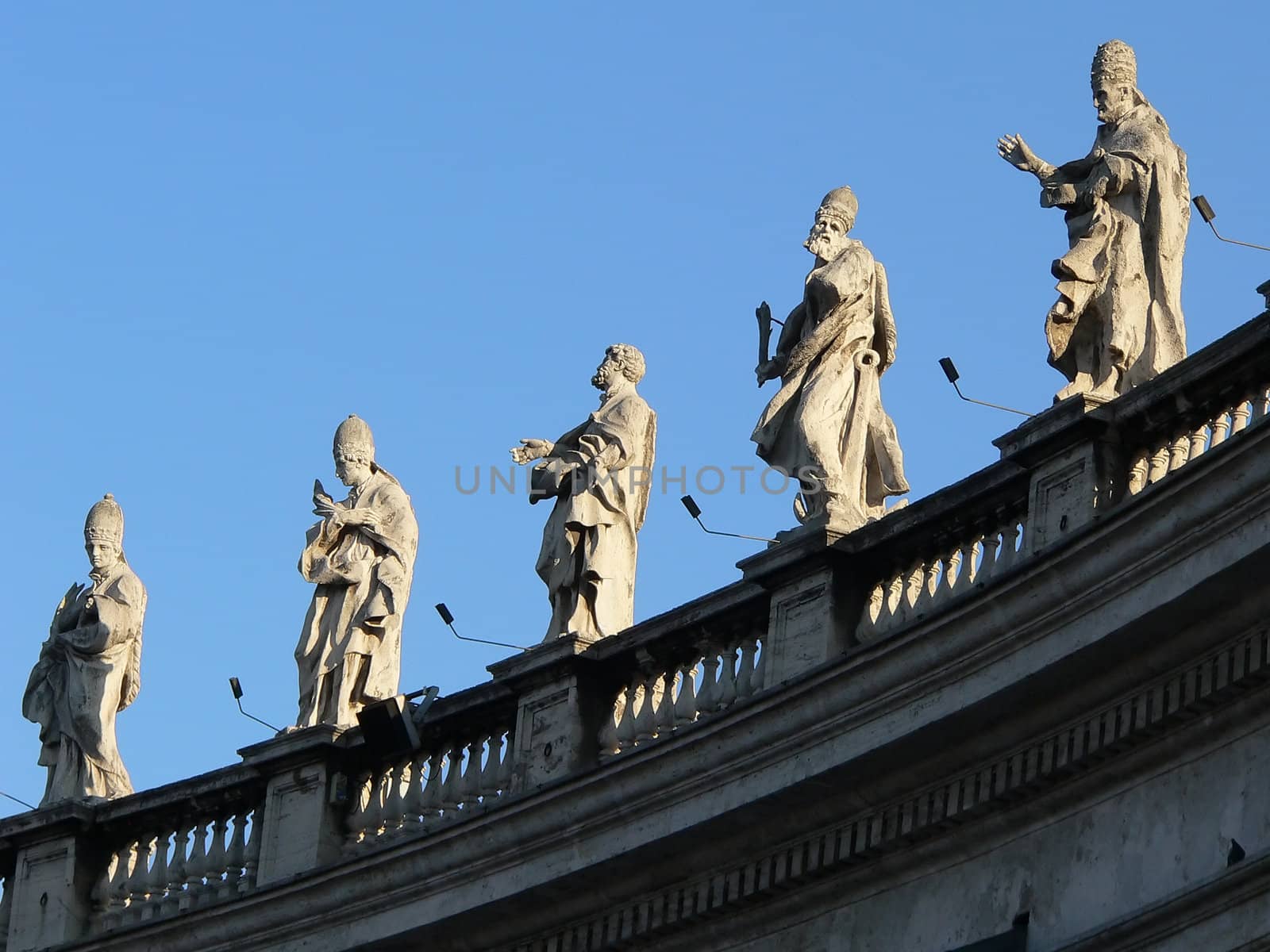 statues in s.pietro in rome whit clouds