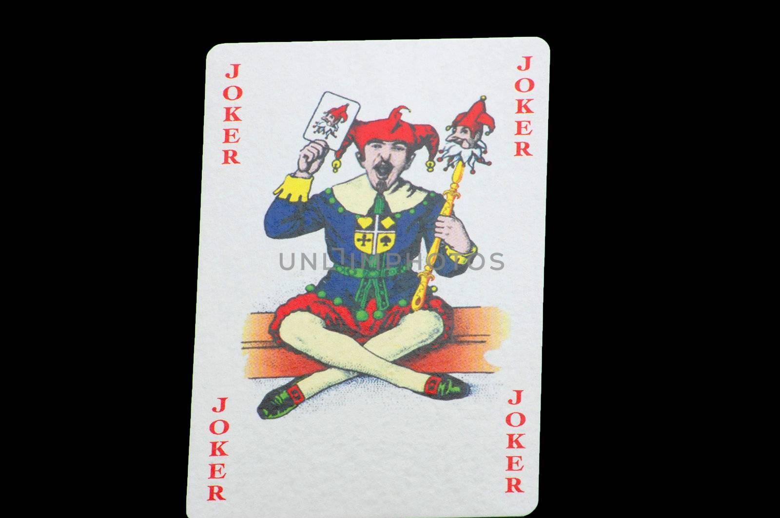 joker card isolated on the black background