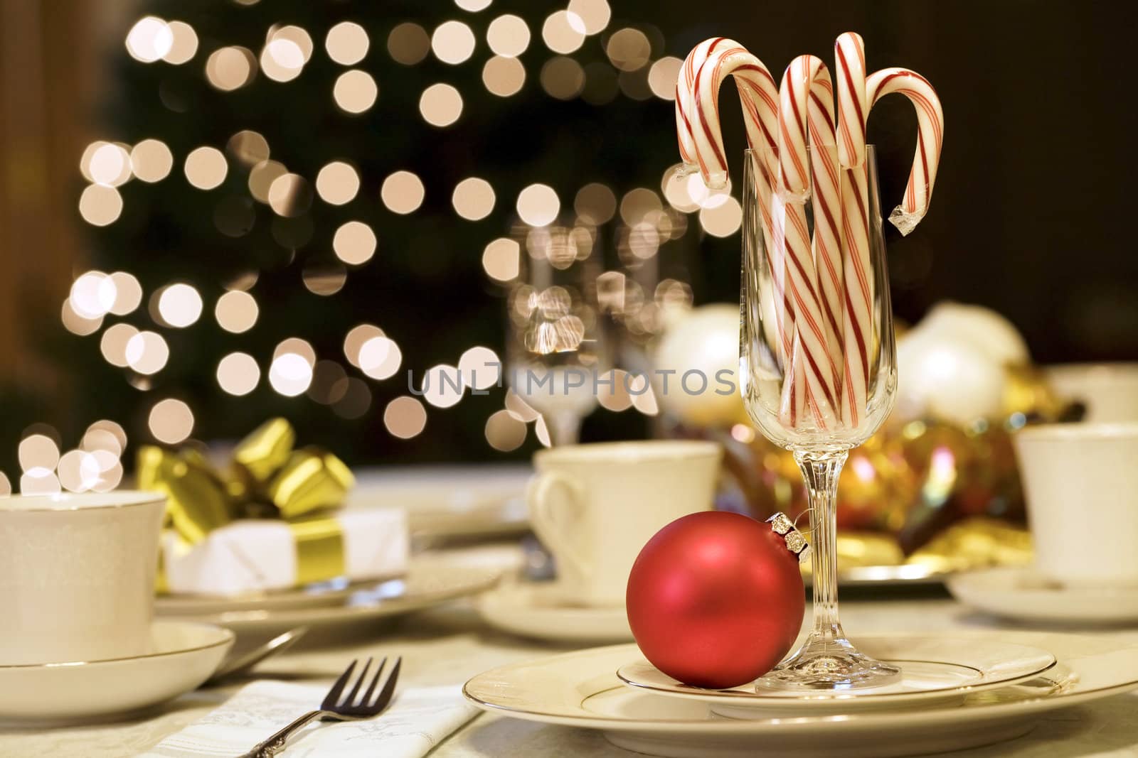 Candy canes and ornaments on table by jarenwicklund