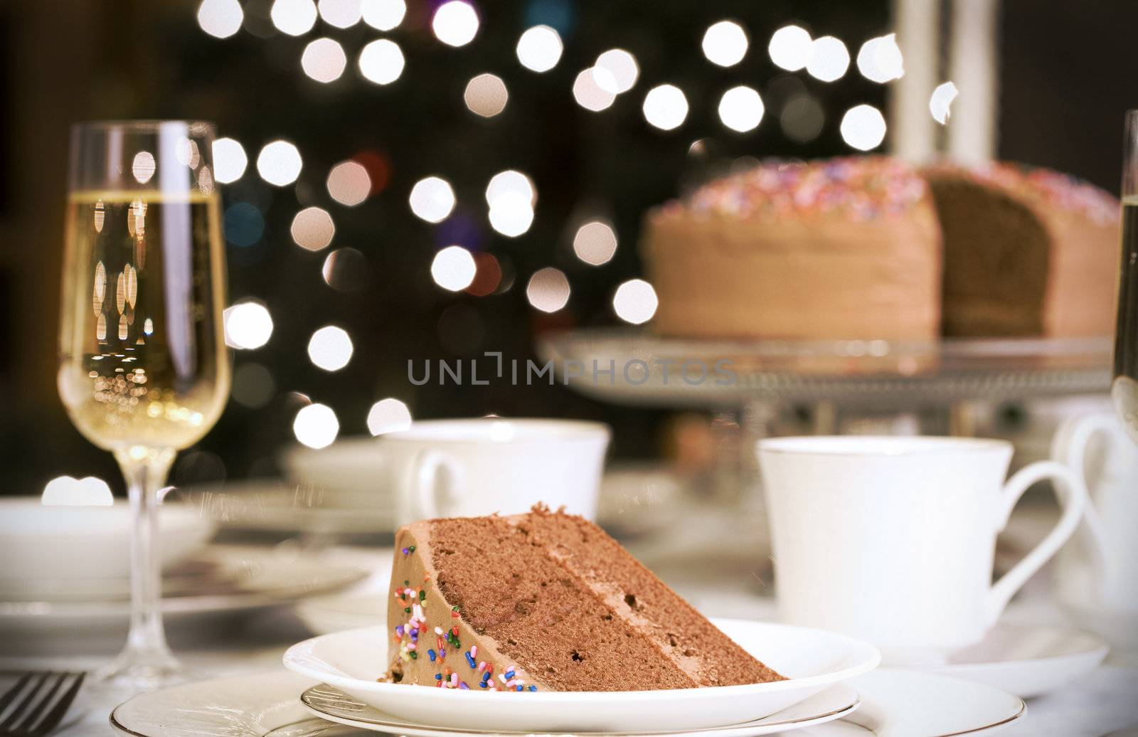 Piece of chocolate cake on set table