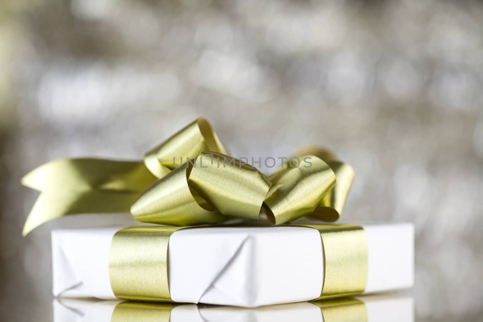 White present with gold ribbons by jarenwicklund