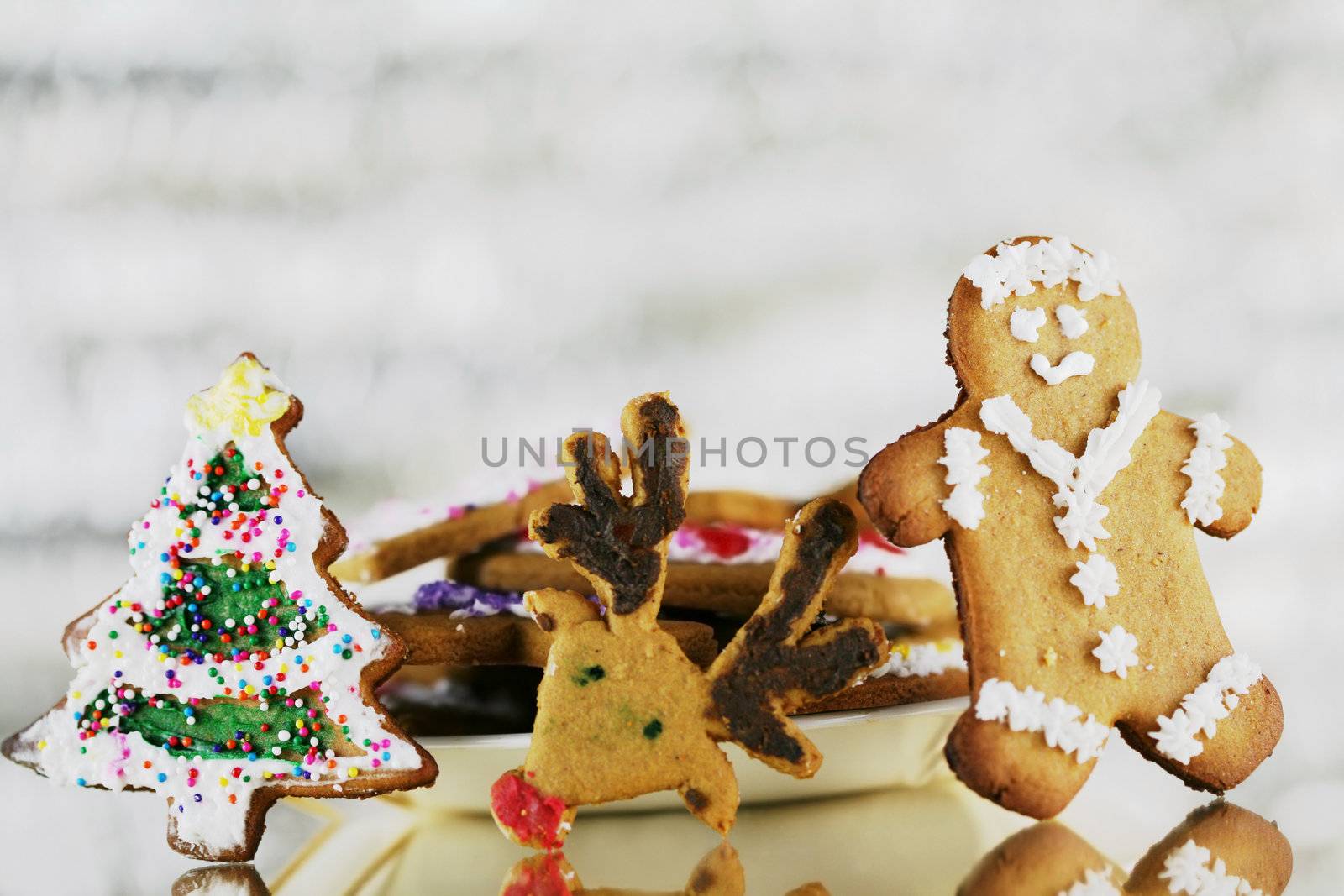Decorated Gingerbread cookies  with glittery silver background lights