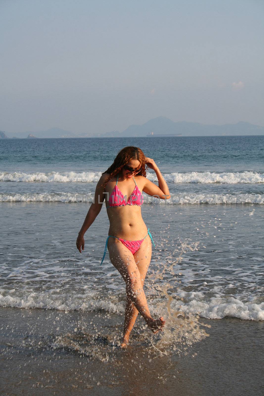 Beautiful young woman on beach