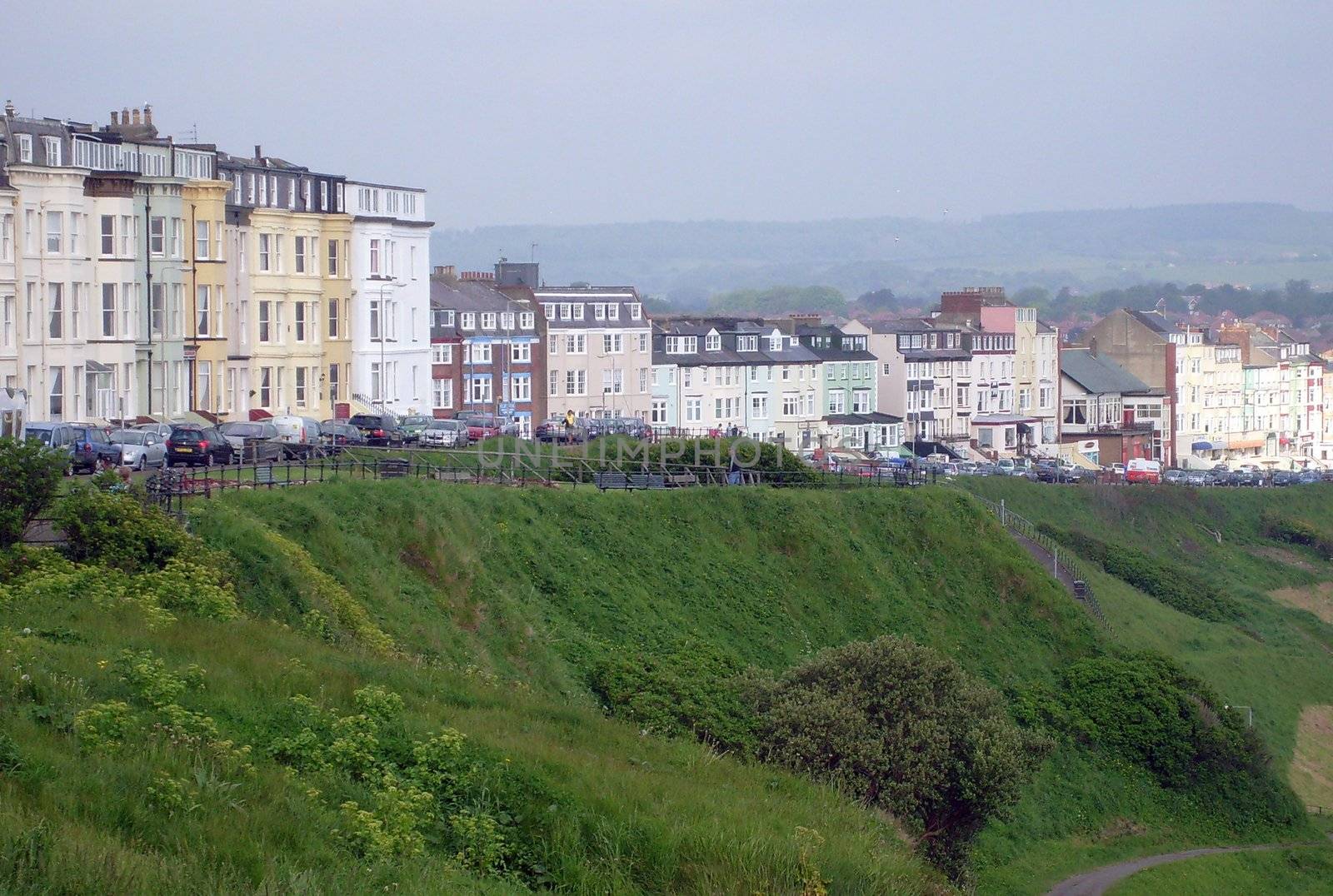 Tourist bed and breakfast hotels on edge of cliff in resort of Scarborough, England.