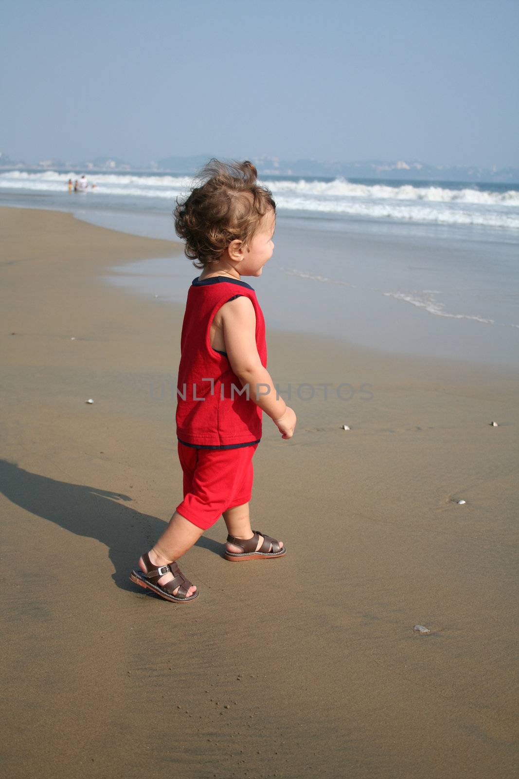 Little boy playing on the beach