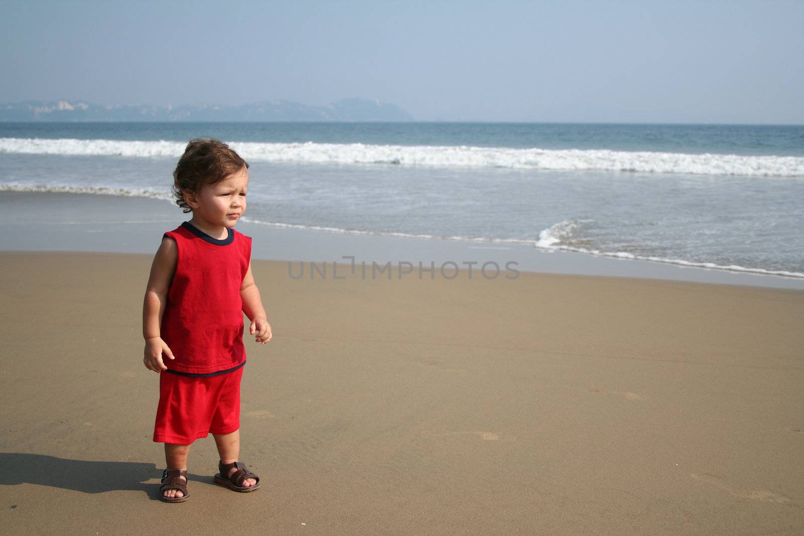 Little boy playing on the beach