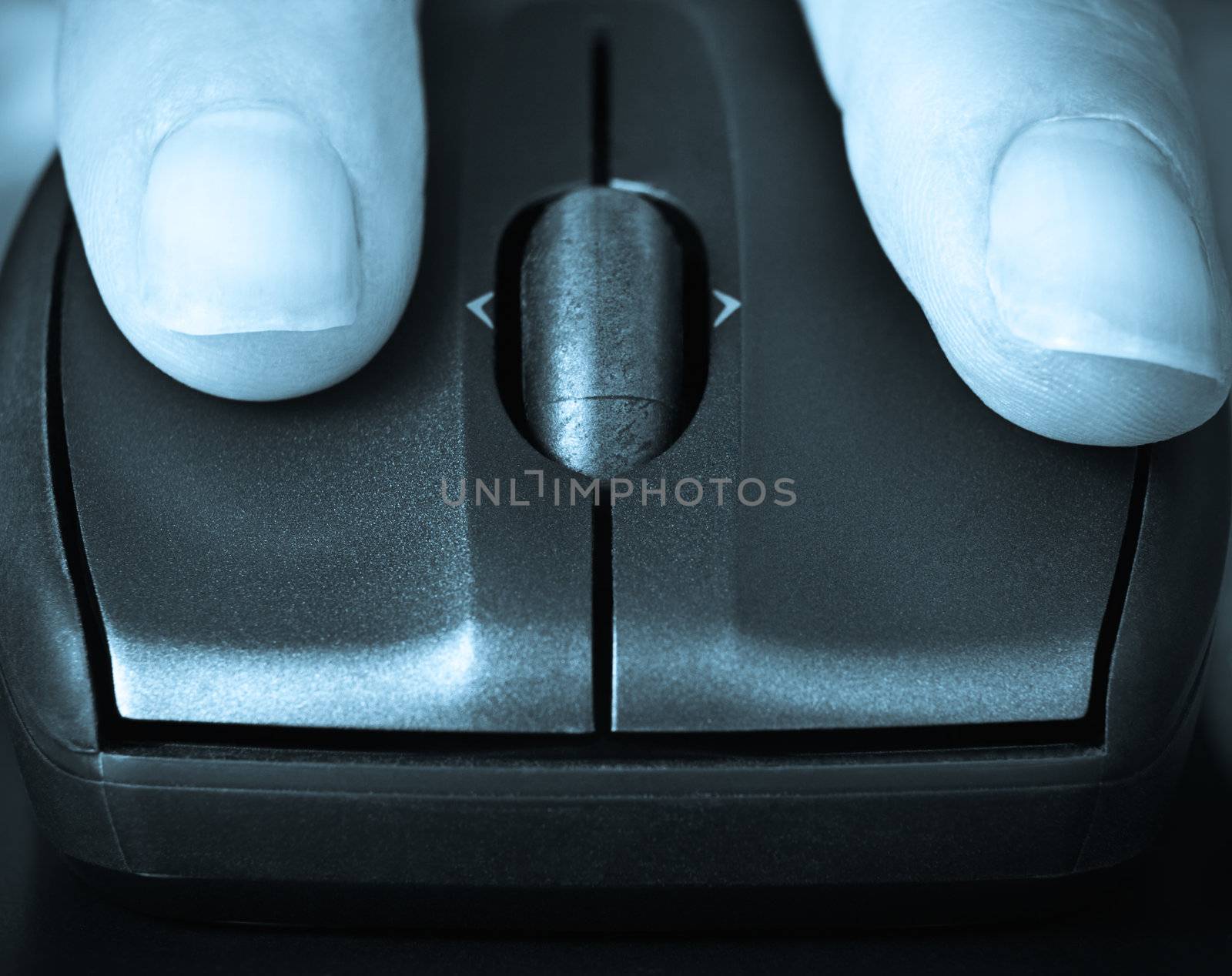 closeup of fingers on a computer mouse clicking,suggesting searching or informing, blue toned