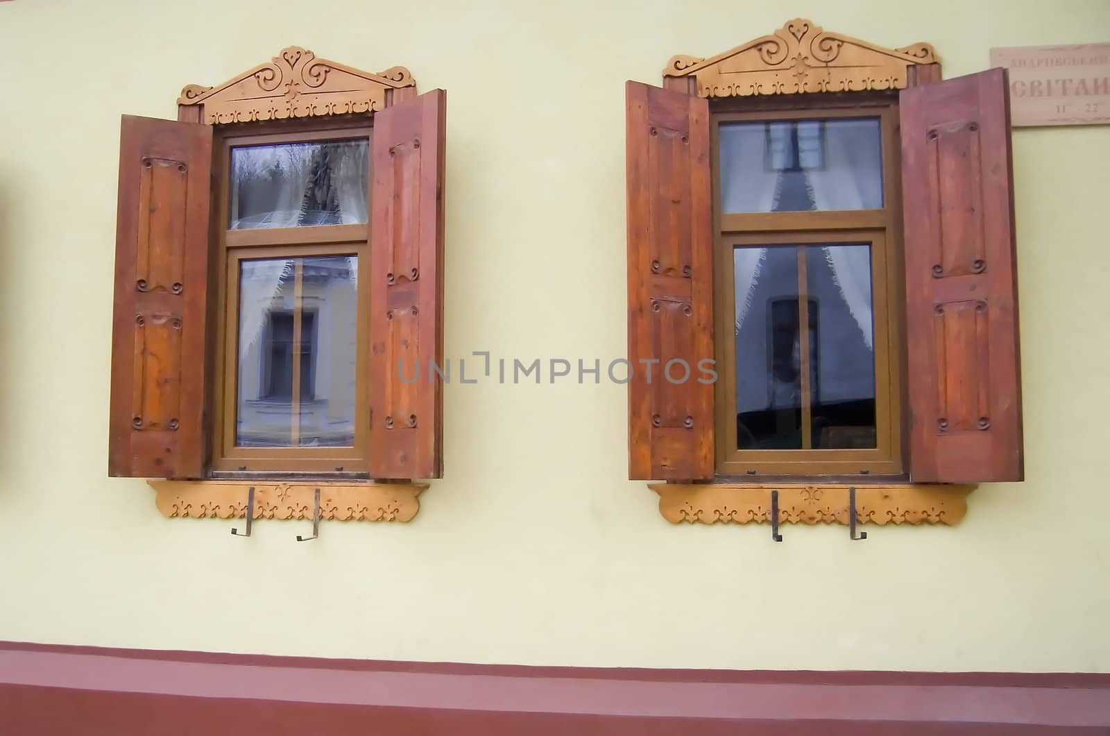 Wooden windows of a cafe on Andreevskaya Street