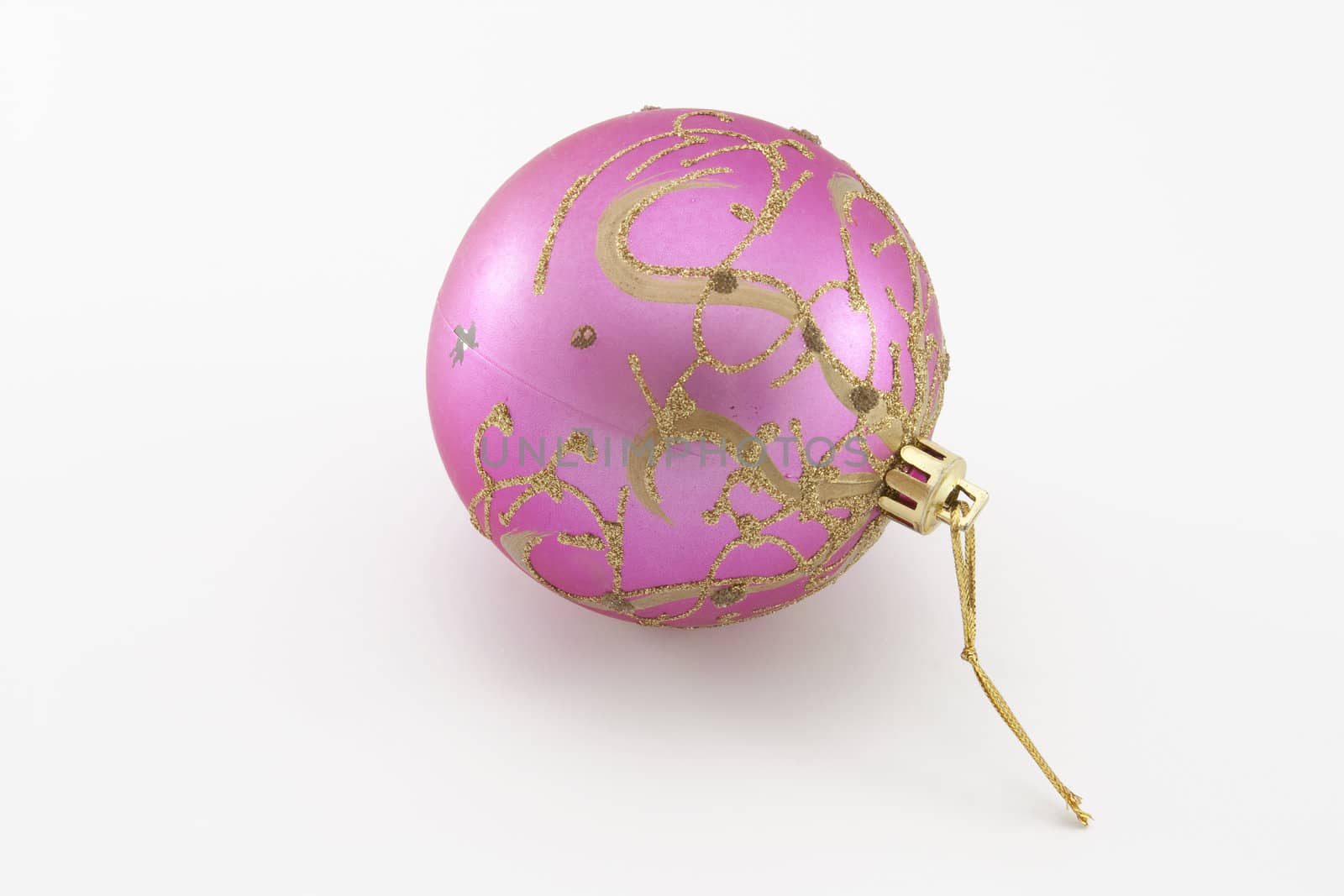 Fur-tree toy - a pink sphere on the white backgroud