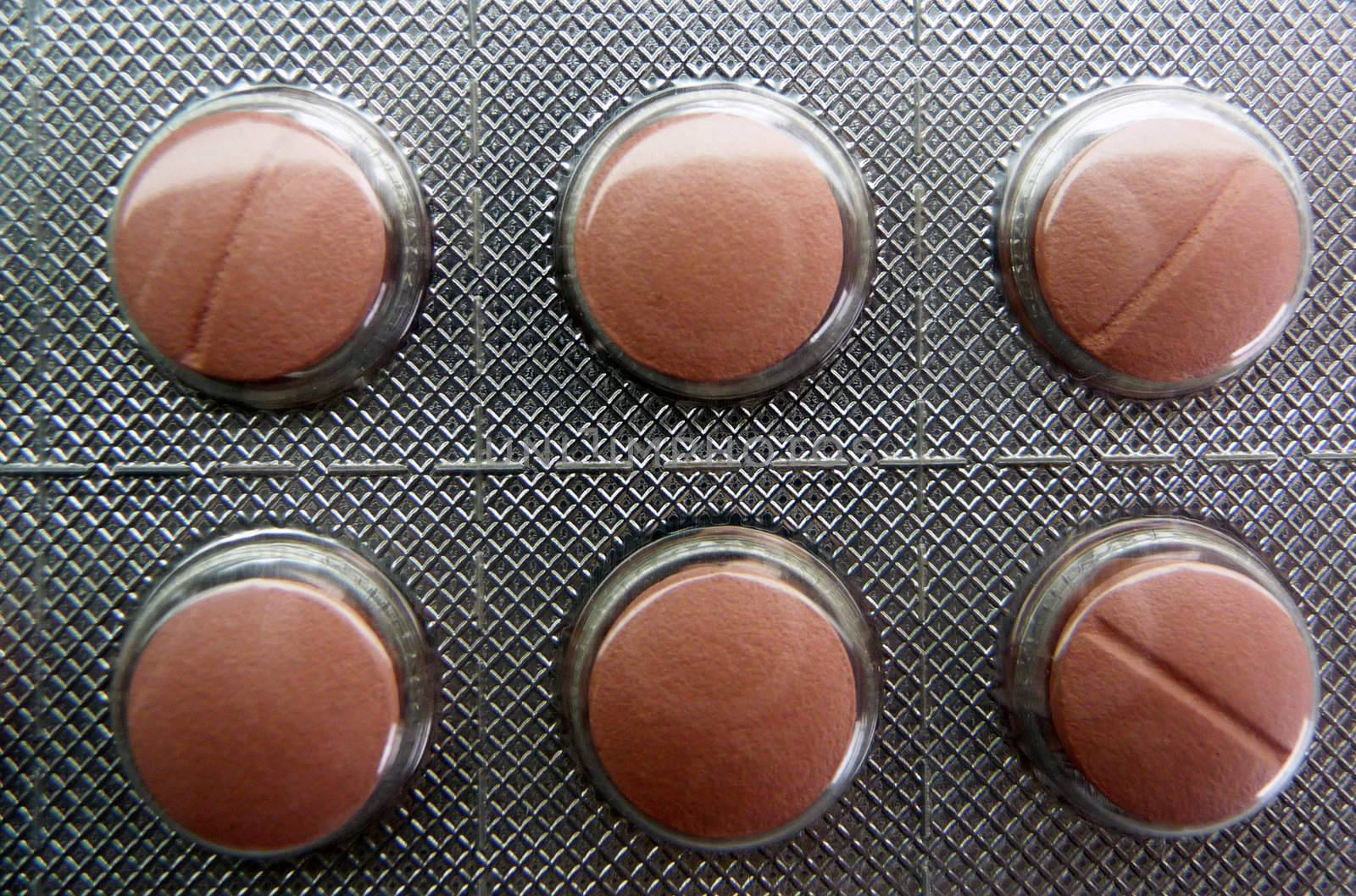 Six red pills - macro photo