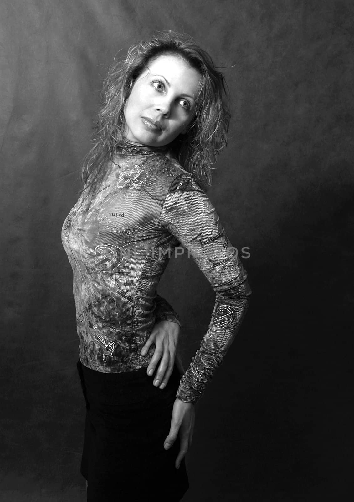 Portrait of the beautiful woman in studio revolved to the right. b/w