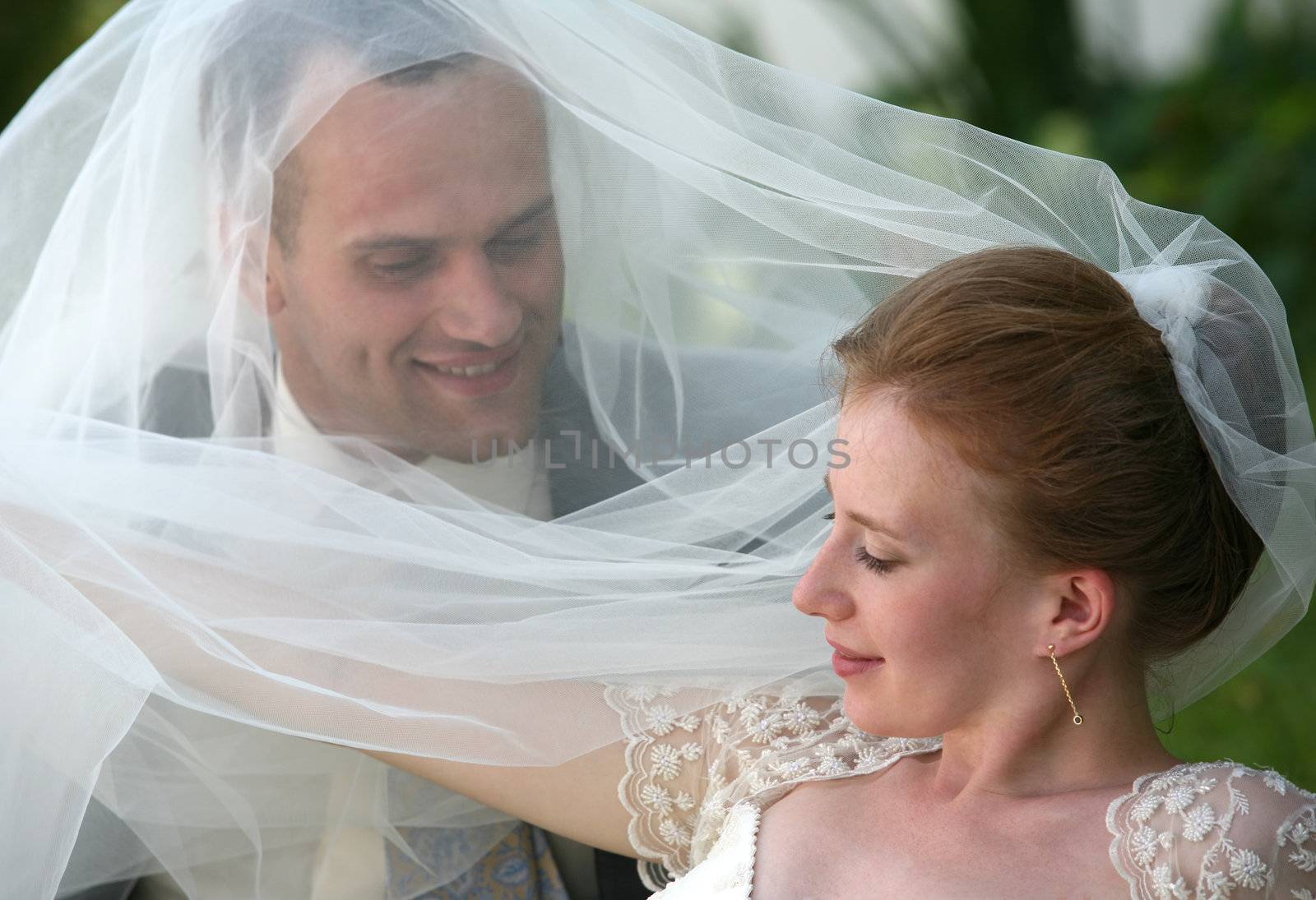 The groom and the bride in park