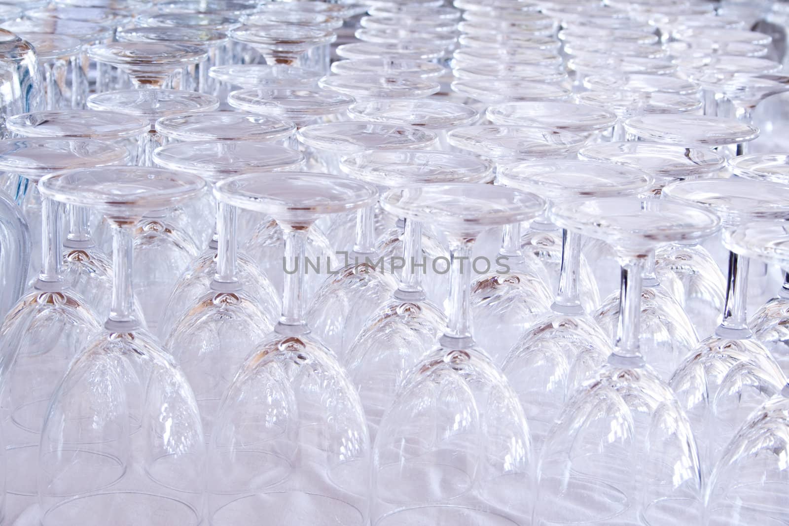 Crystal wine-glass background in a bar.