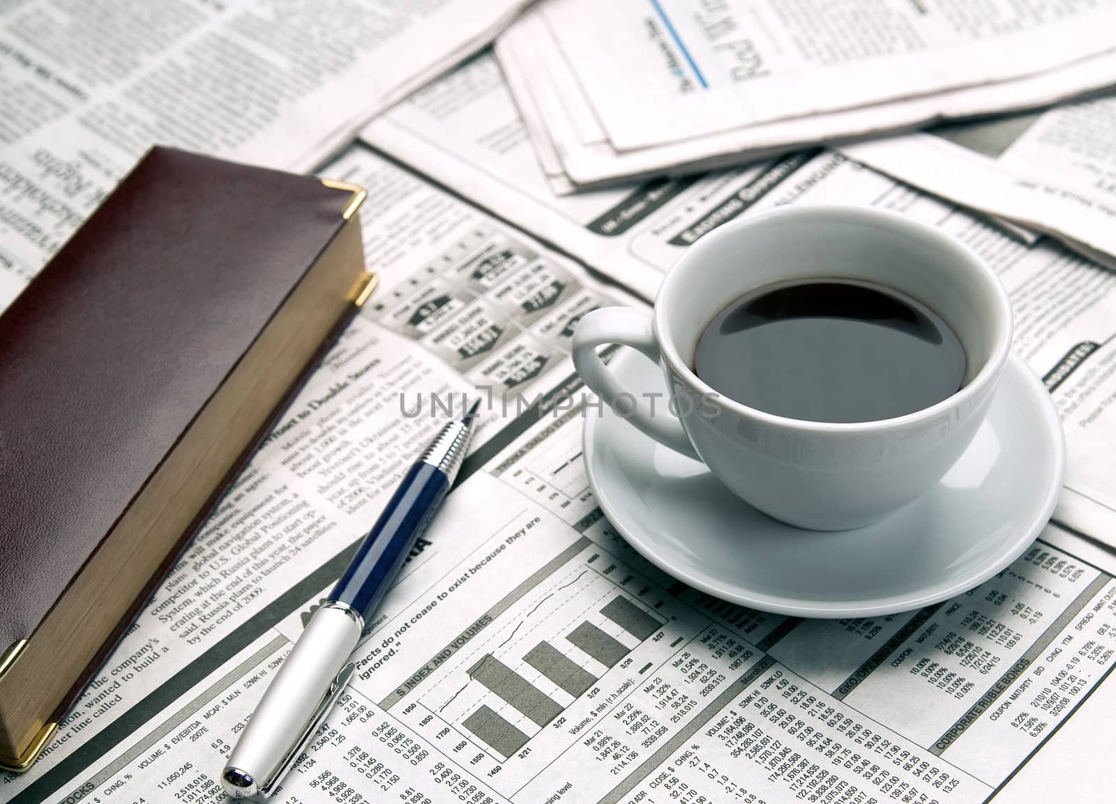 Cup of coffee on the newspaper by zeffss