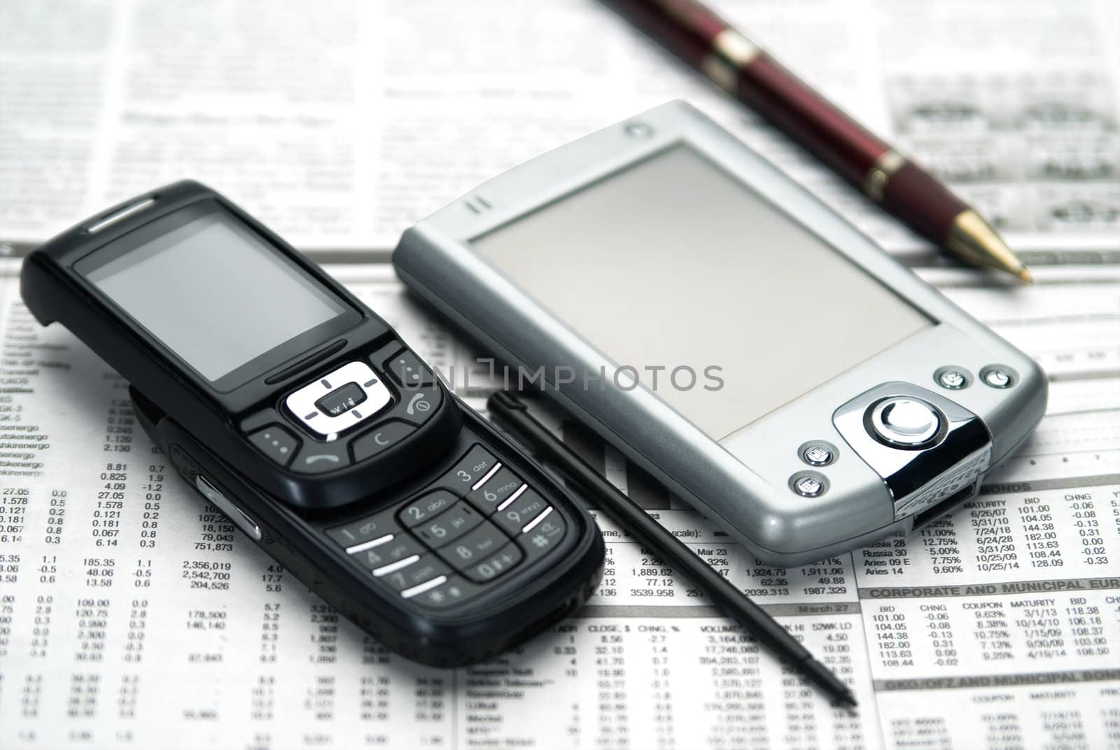 Pen, pocket, mobile on newspaper. by zeffss