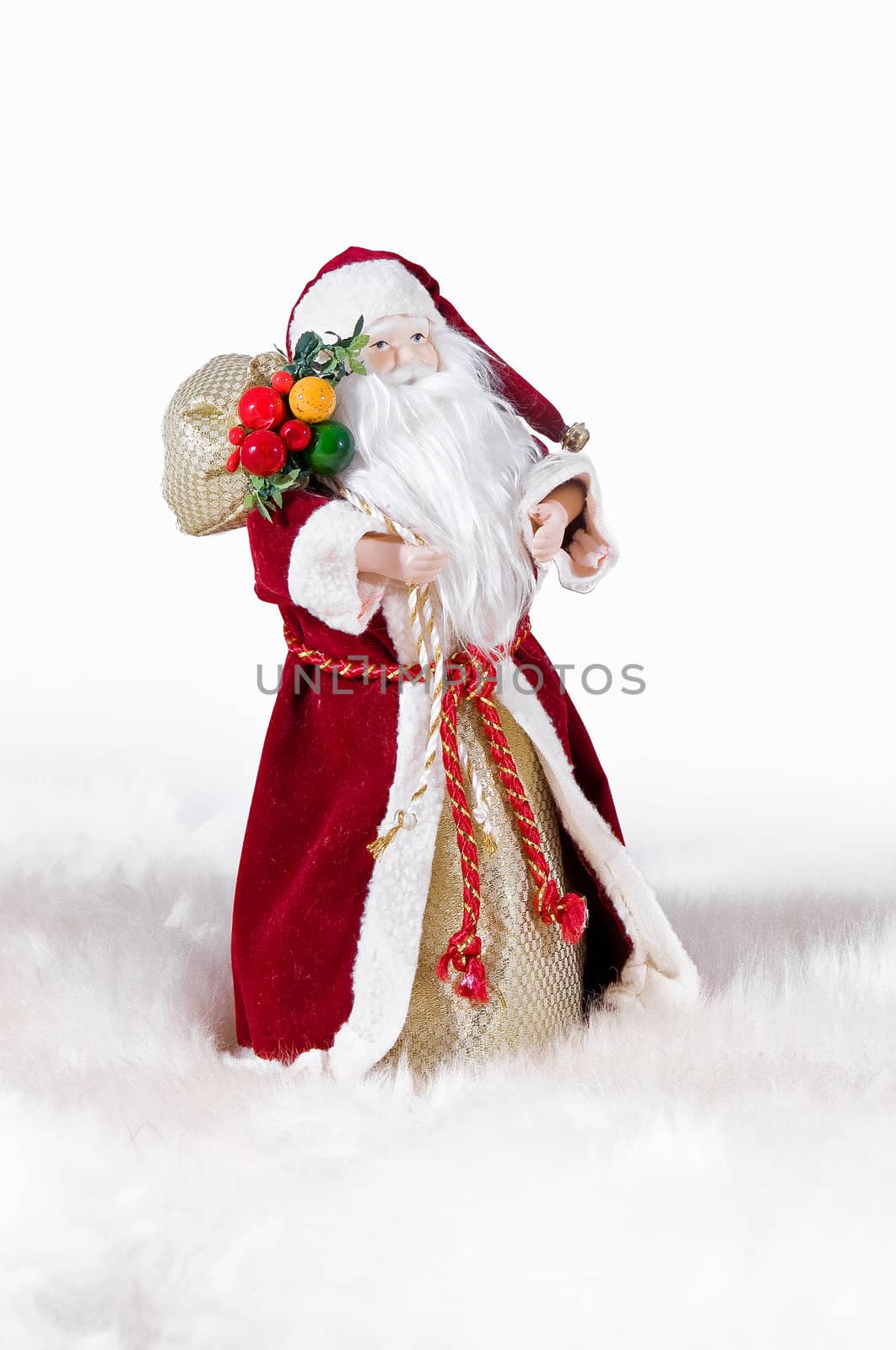 Happy Christmas toy Santa. It is isolated above a white background
