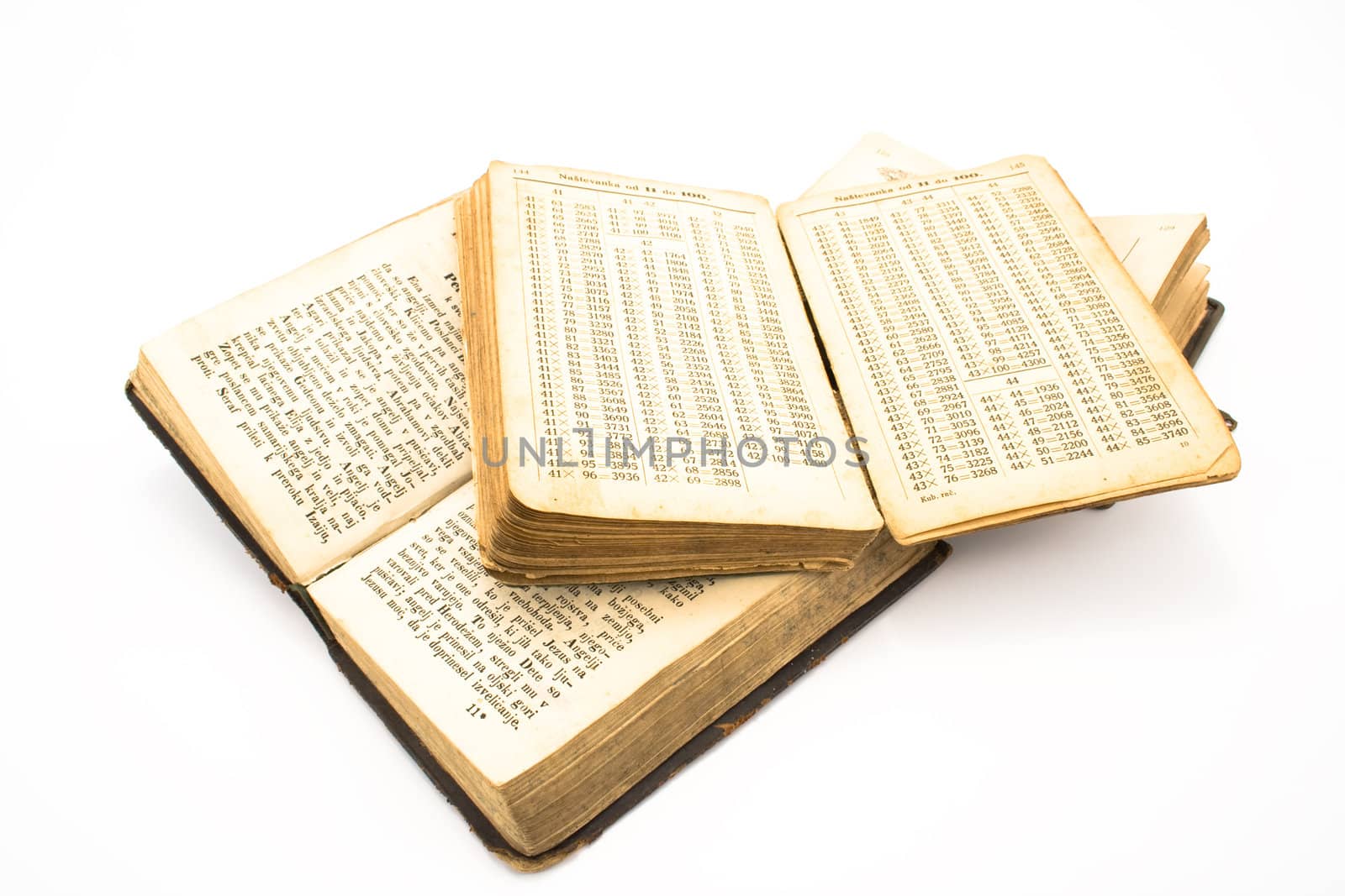 Three opened old books isolated on white background