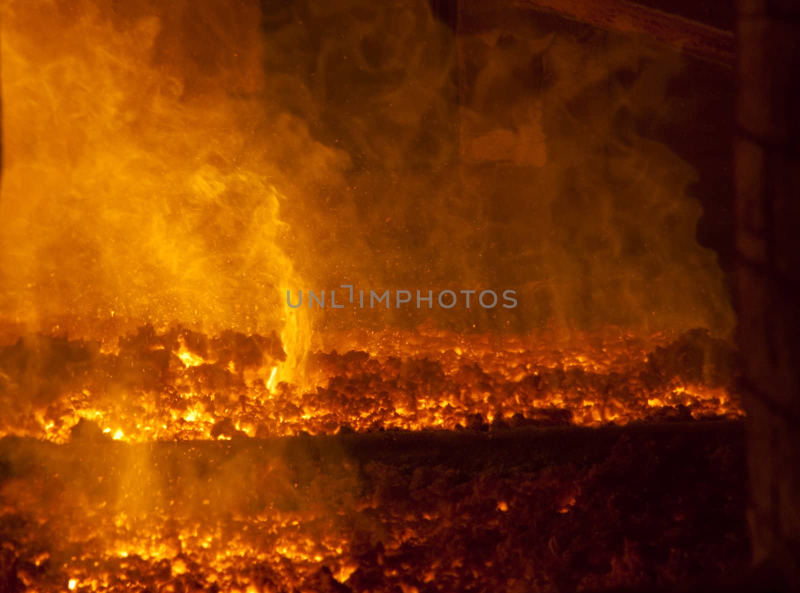 Close up on fire in the big furnace - power station - Poland