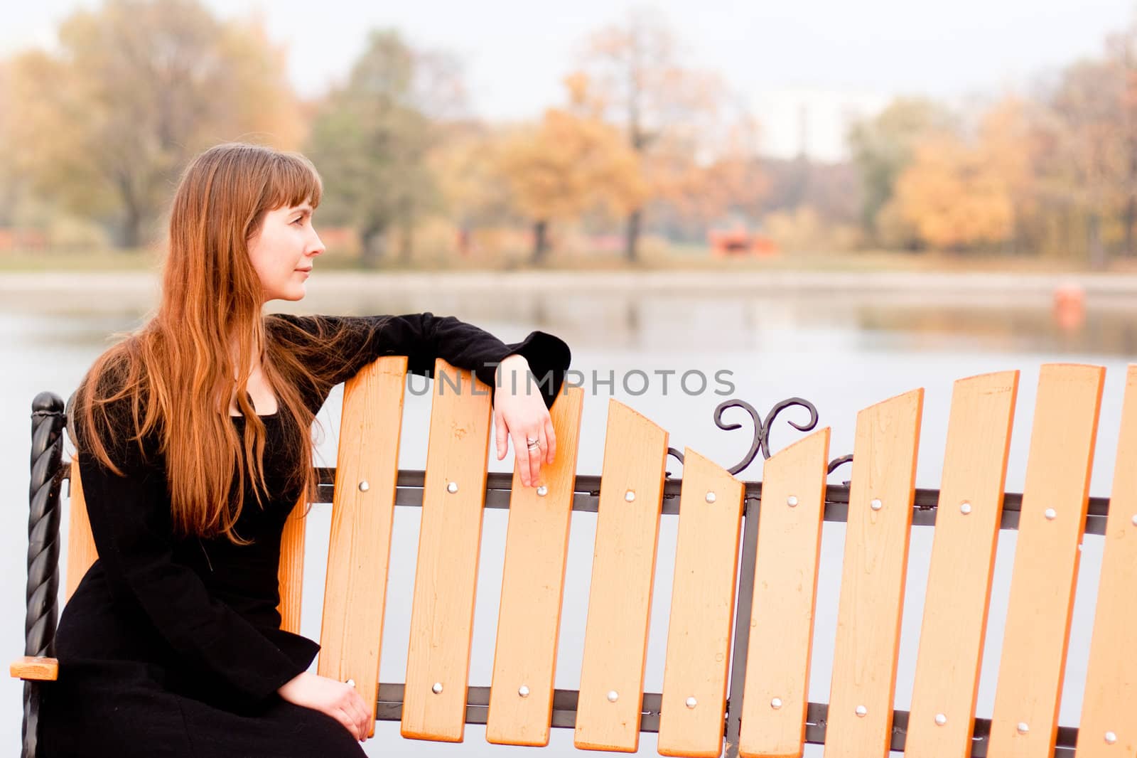 Portrait of  lady in black dress in the park
