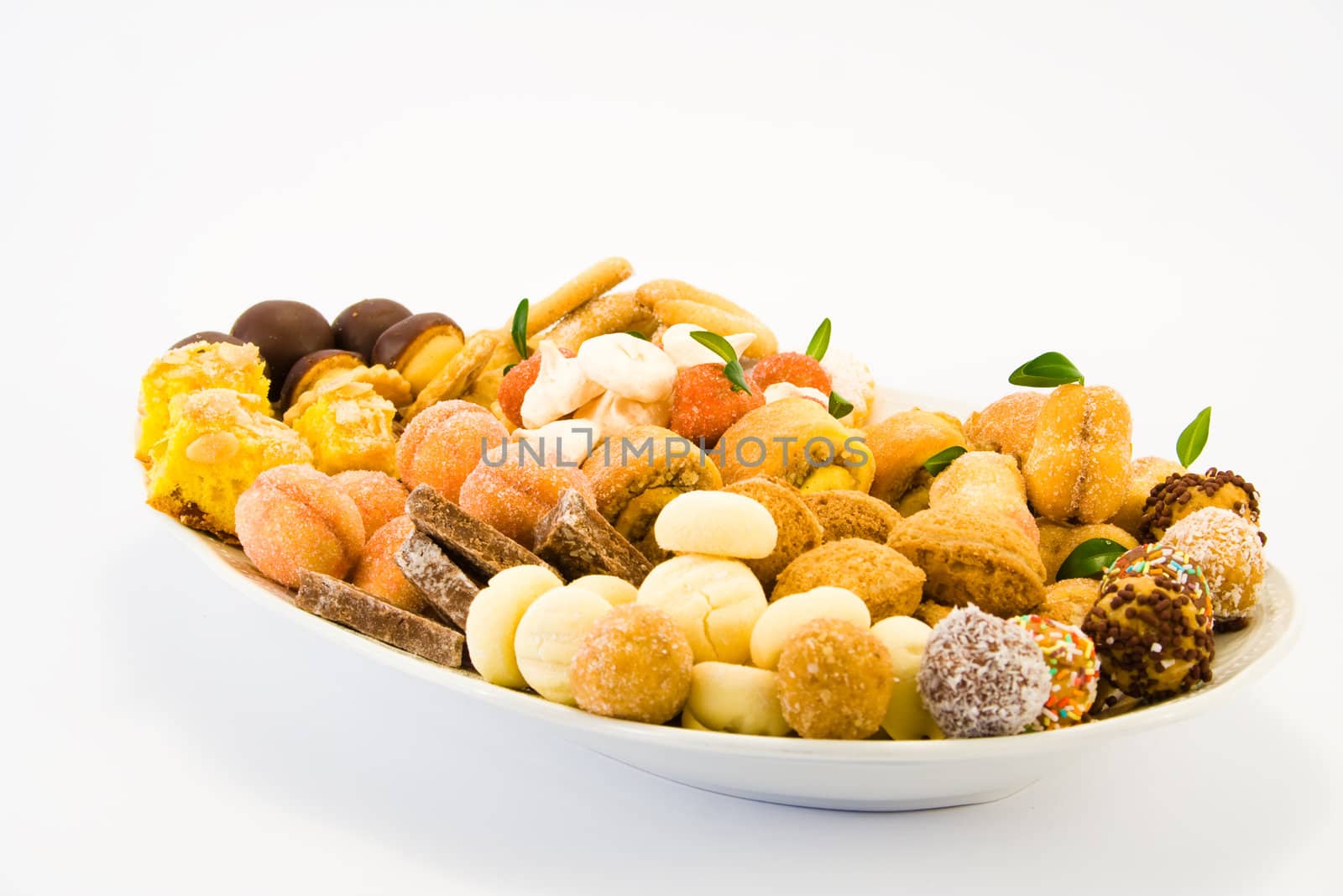 Plate full of cookies of different kind.