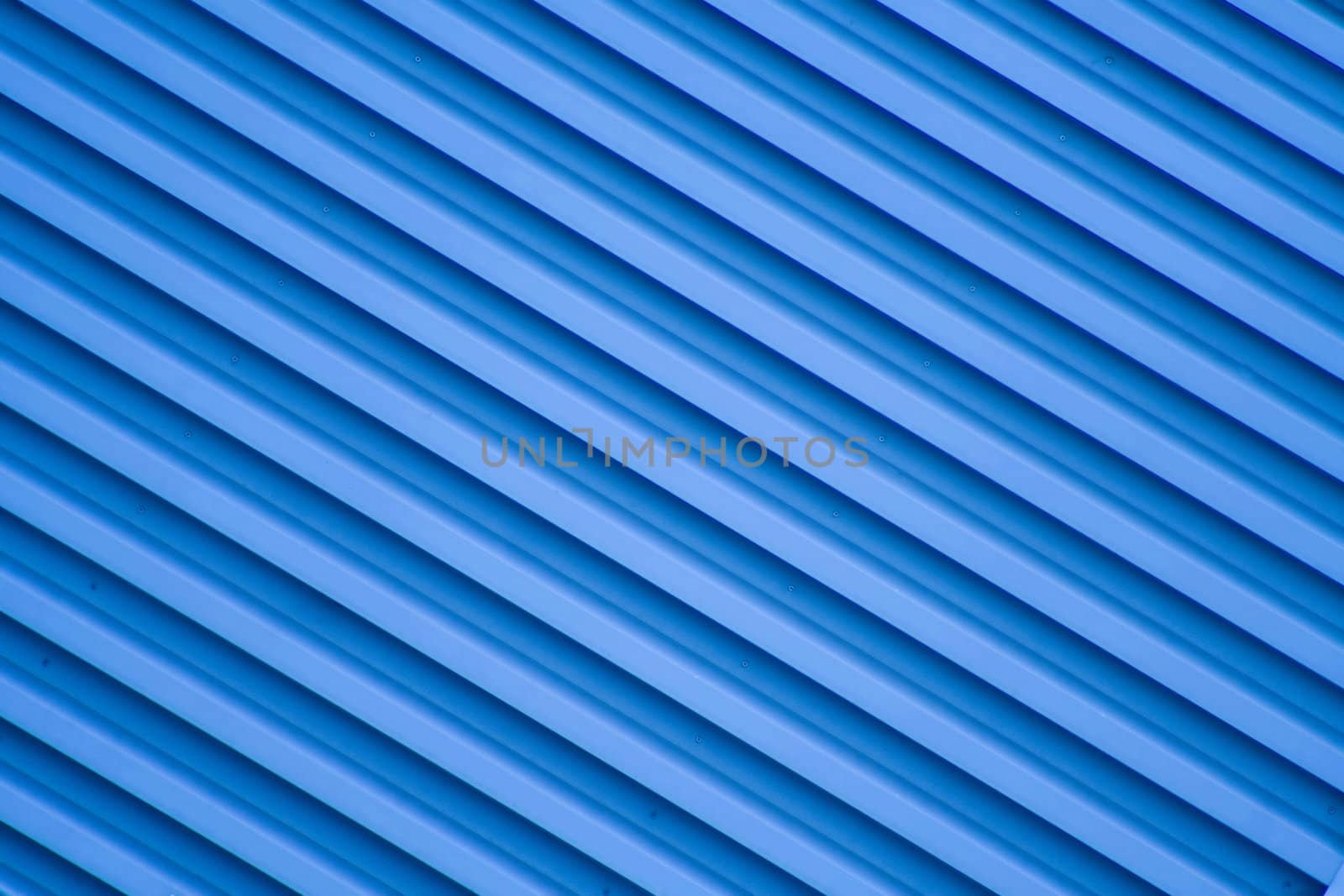 Blue diagonal stripes bacground from a building.