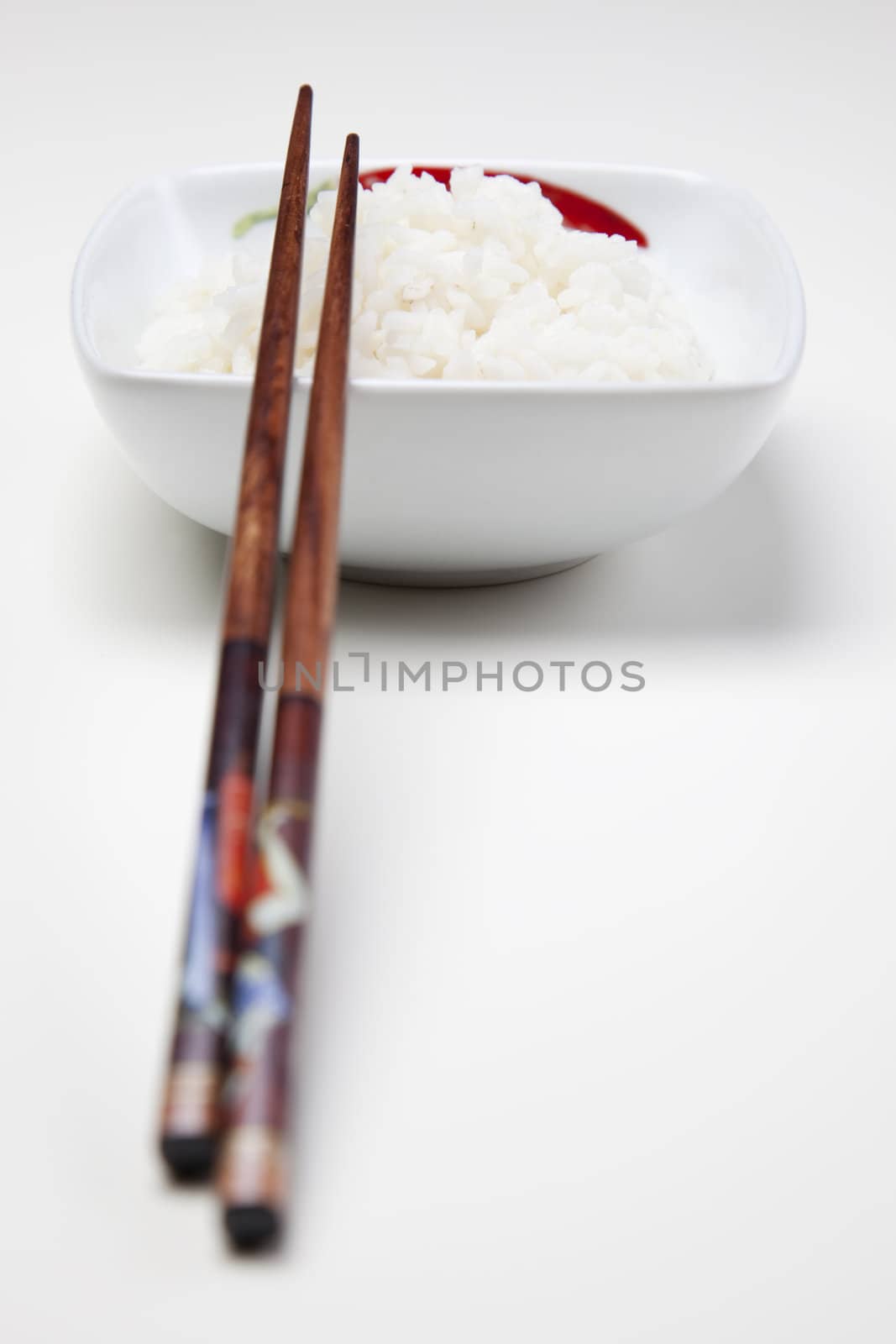 Bowl of white rice isolated on white