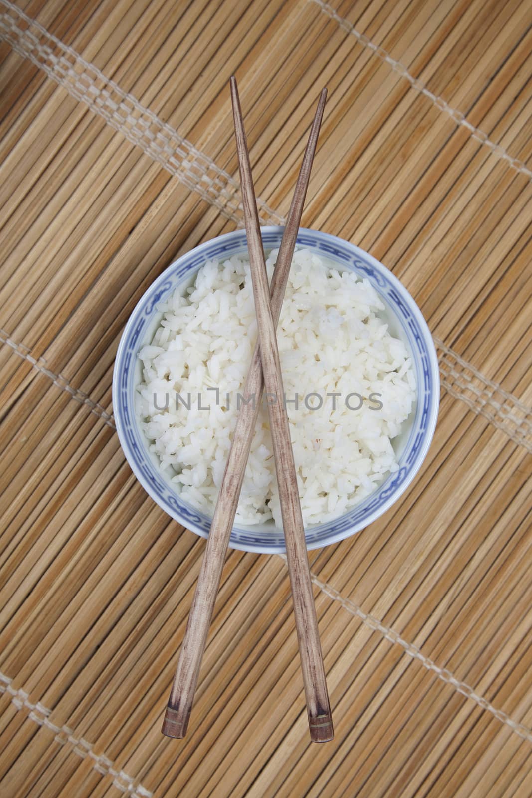 Bowl of white rice on tatami mat