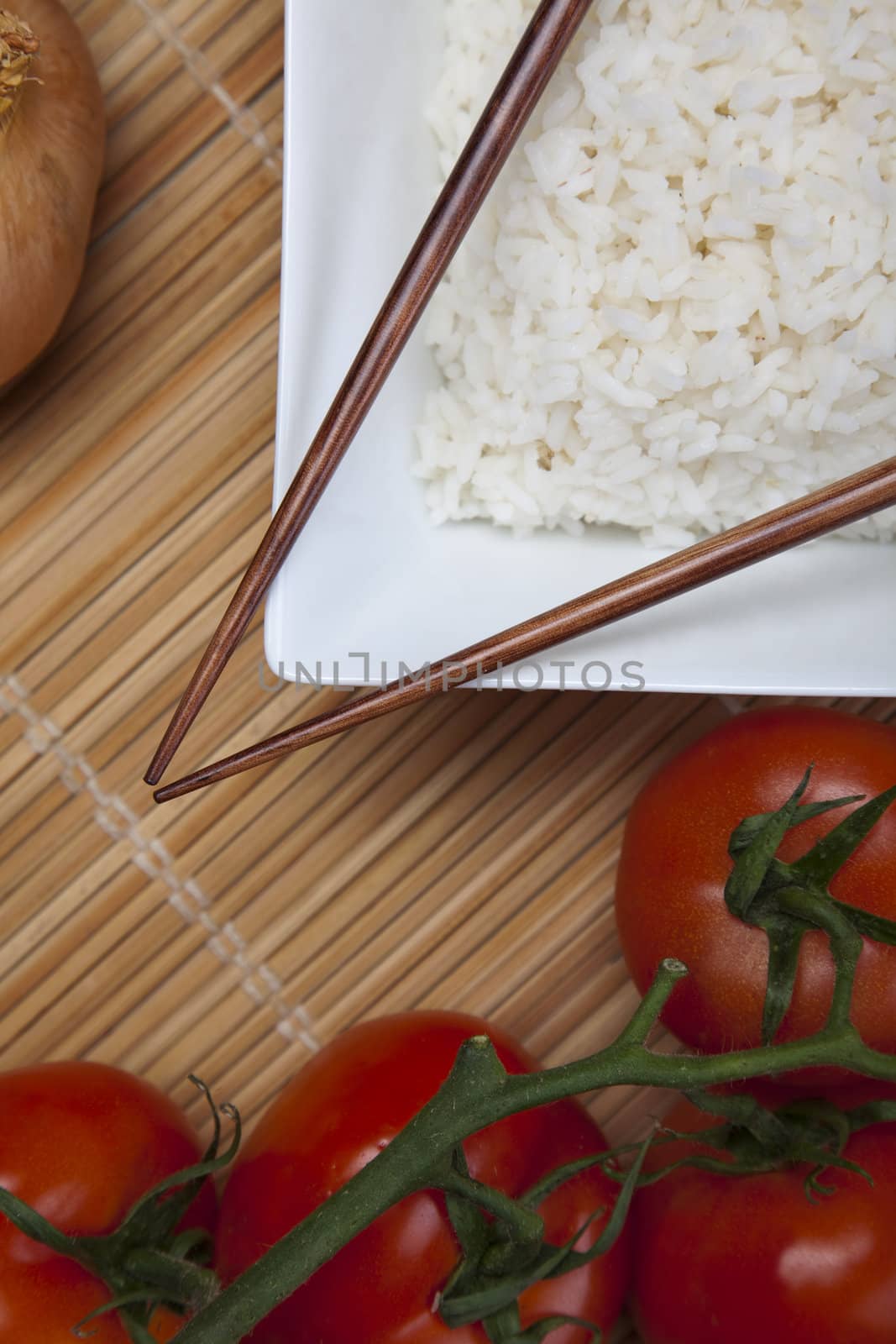 Bowl of white rice on tatami mat by shiffti