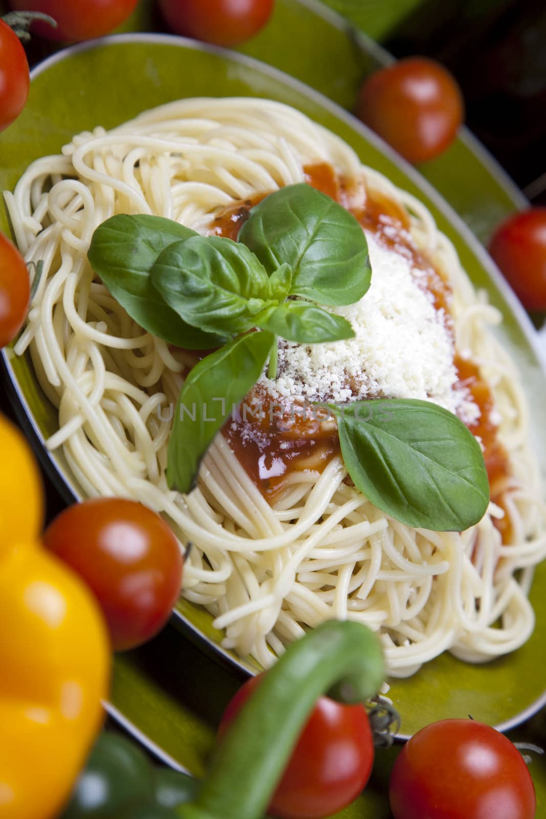 Pasta with tomato sauce basil and grated parmesan