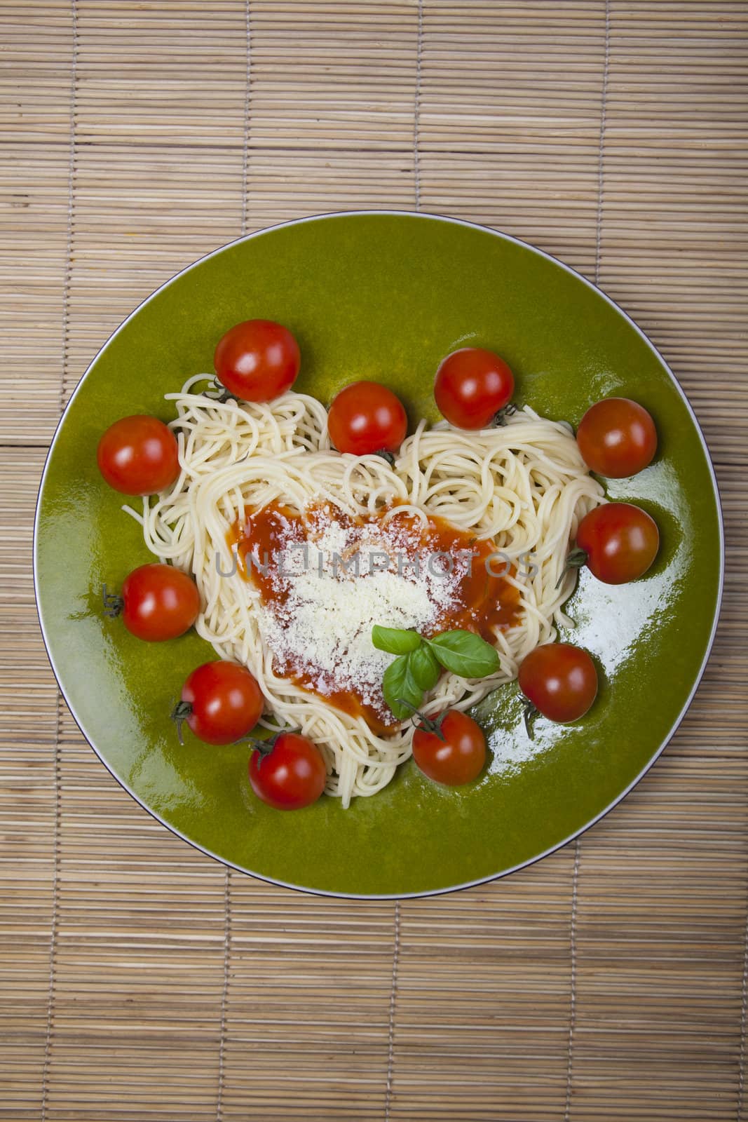 Pasta with tomato sauce basil and grated parmesan