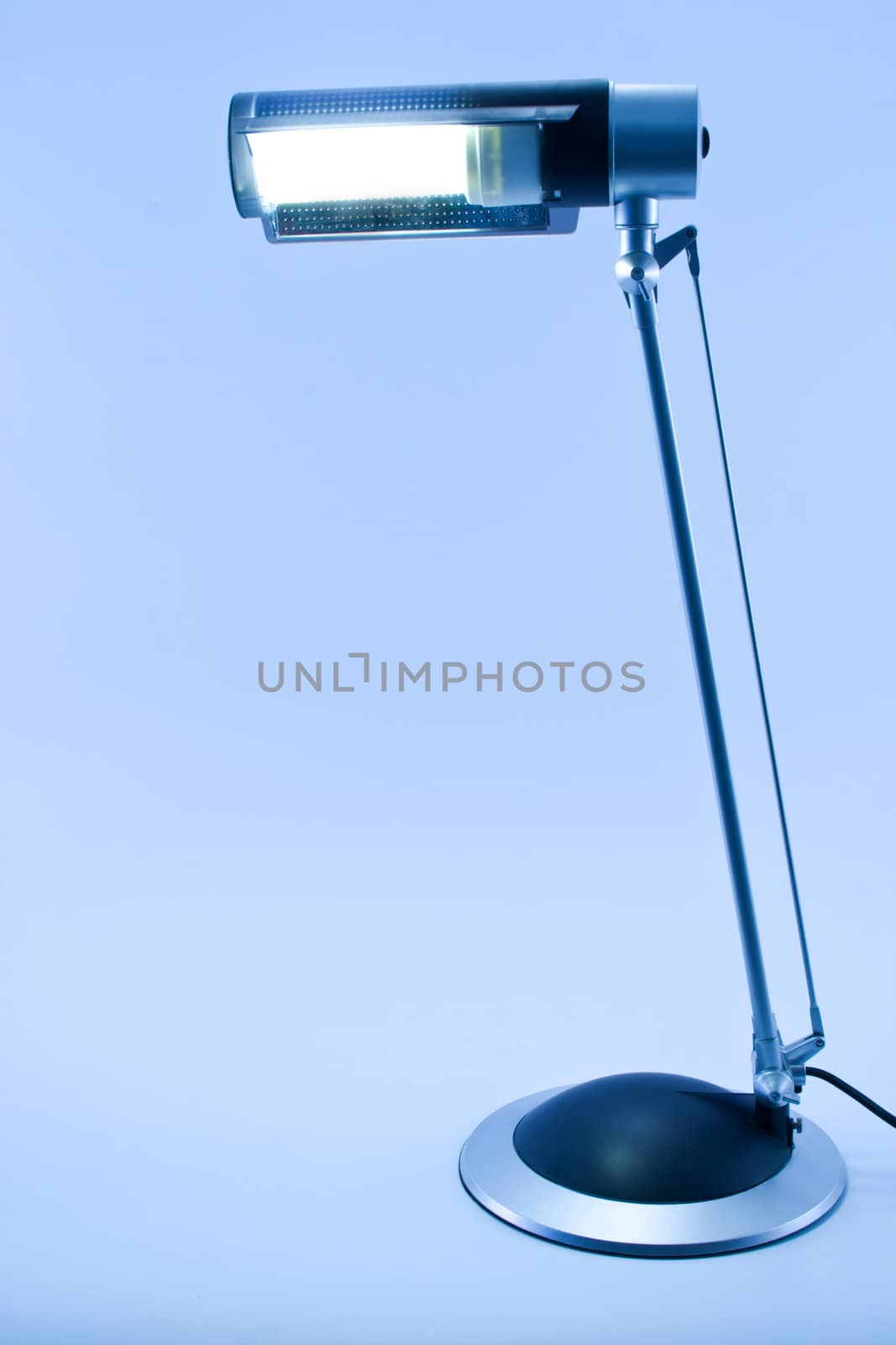 Lit table lamp, isolated,with blue tint