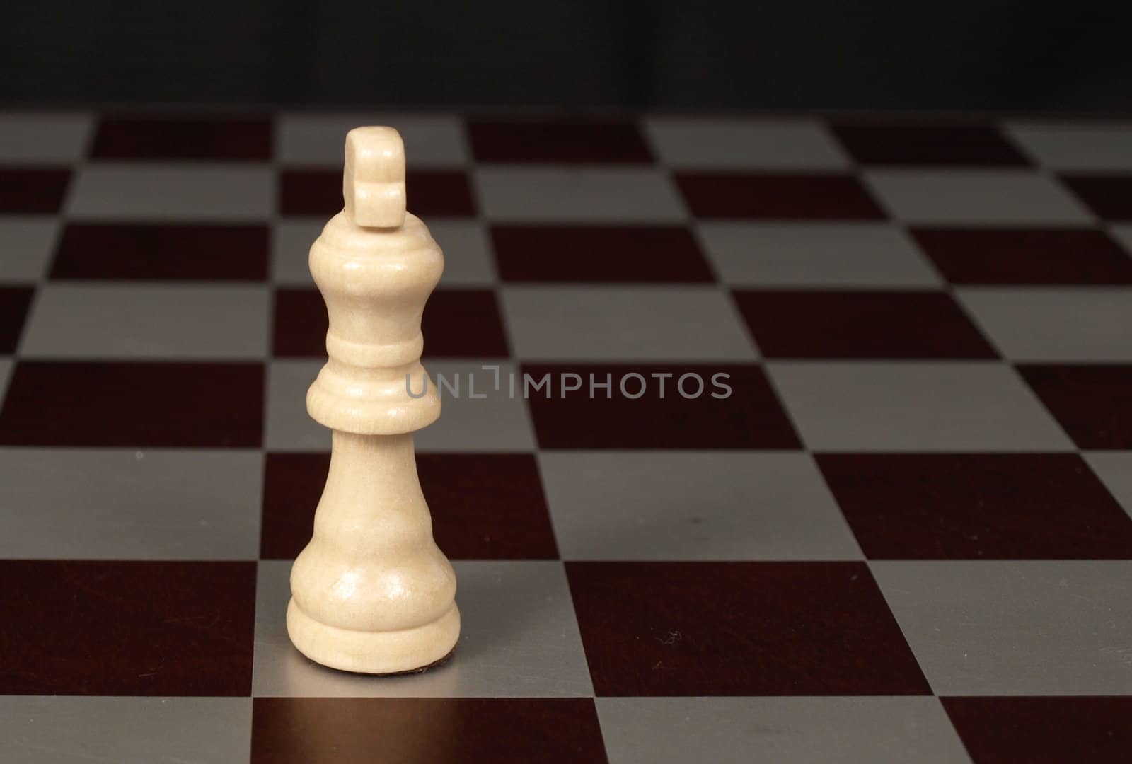 White king on a chessboard shown up close