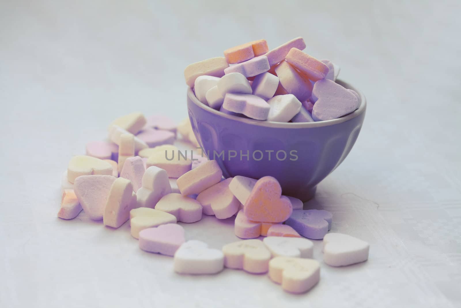 A bowl with heartshaped valentine candies