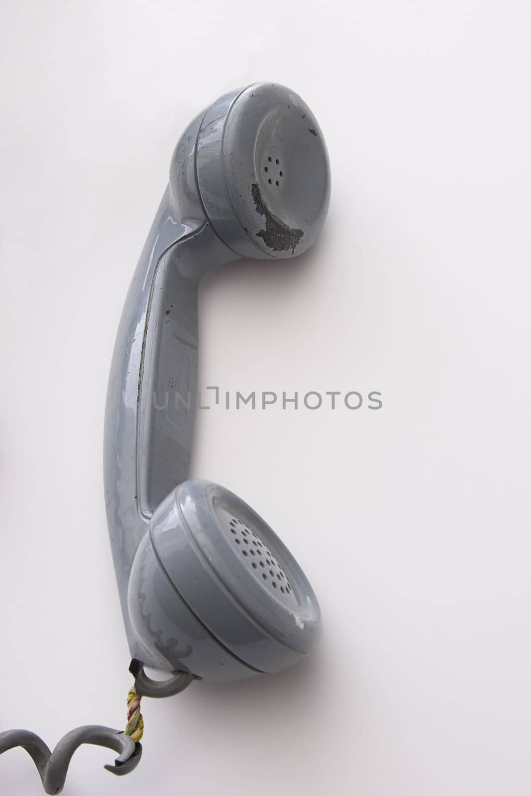dirty vintage gray handset with pelling paint and expose wired