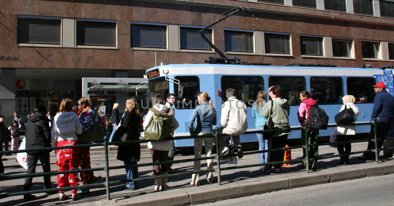 People waiting for the bus, public transportation, Storgata, Oslo. 
