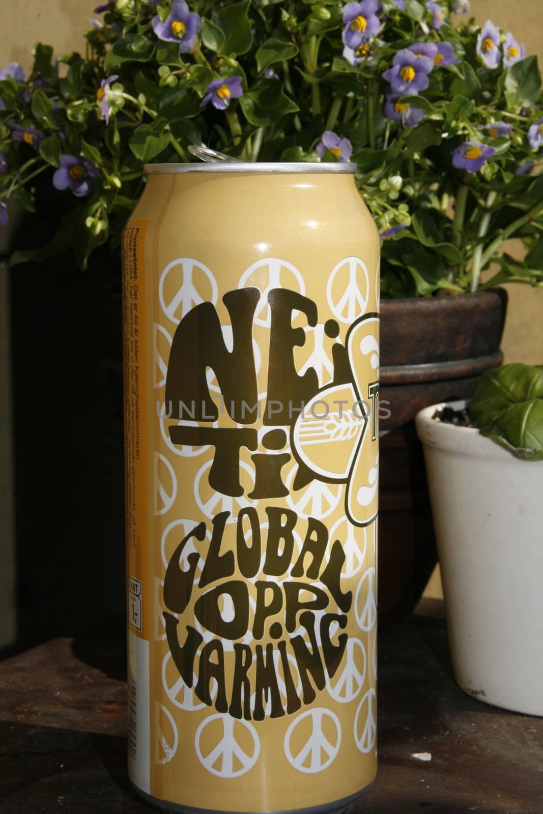 A political correct can of beer. Text: Nei til global oppvarming. Marketing gimmick.
