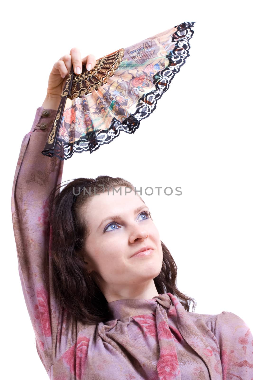 fan in the hand of young happy girl