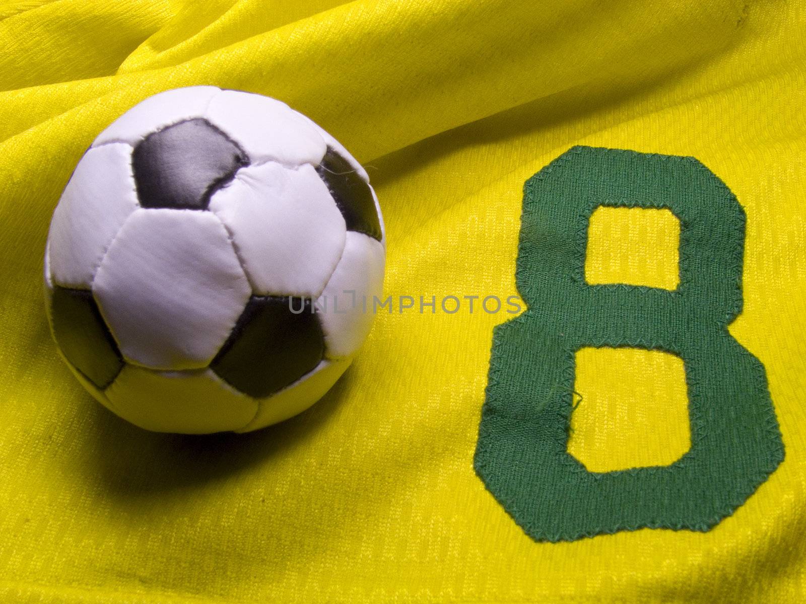 photo of the soccer ball over nuber eight uniform