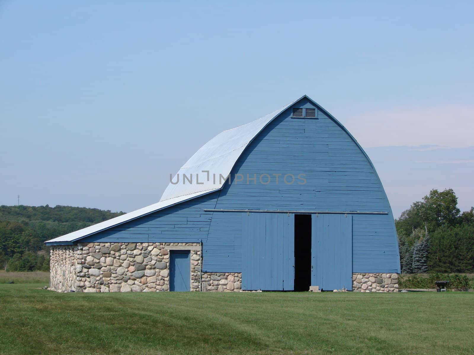 Unusual shaped blue barn by jodygary97
