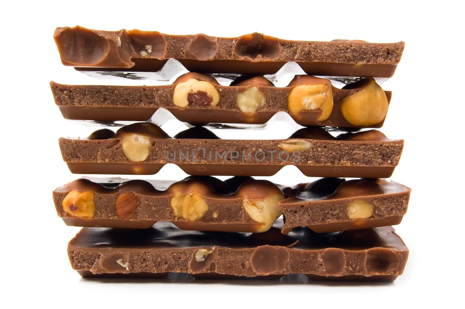 Hazelnut and chocolate on a white background