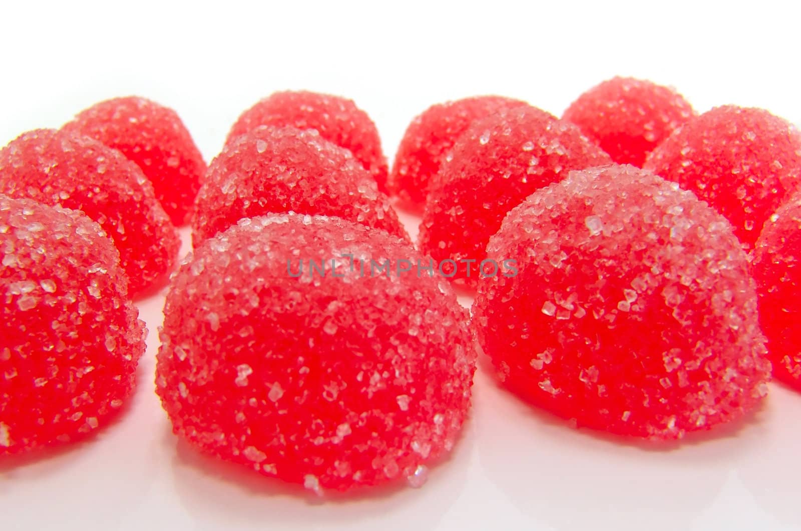 Red fruit candy on a white background        