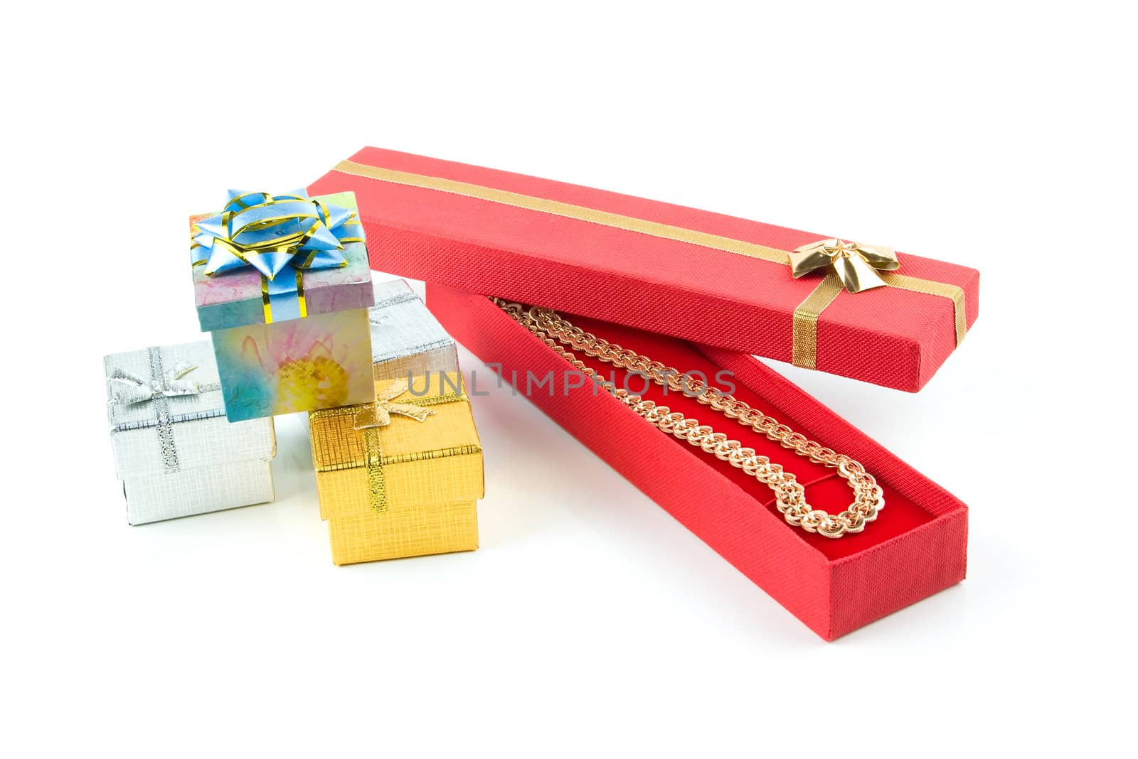 gold necklace in red box. set of gift boxes. white background.