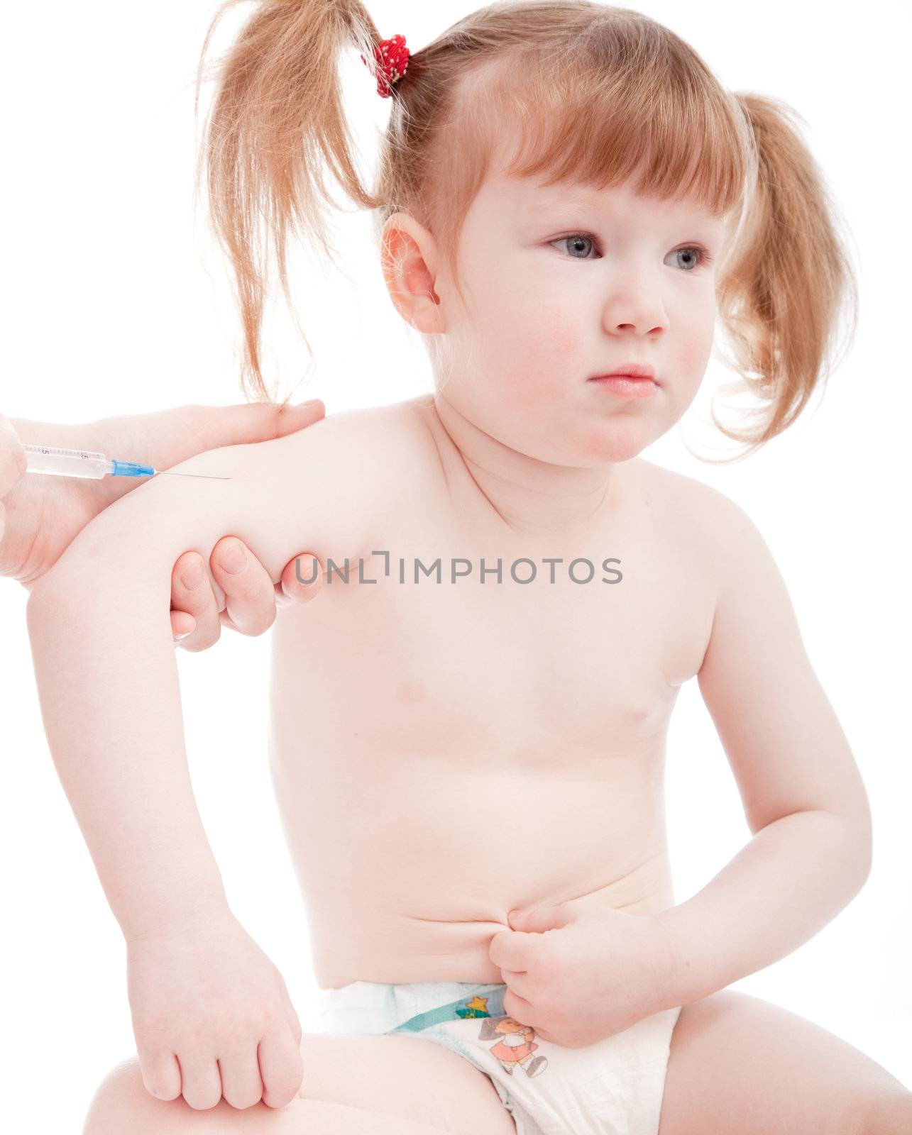 Little caucasian girl in a hospital. Vaccination procedure.