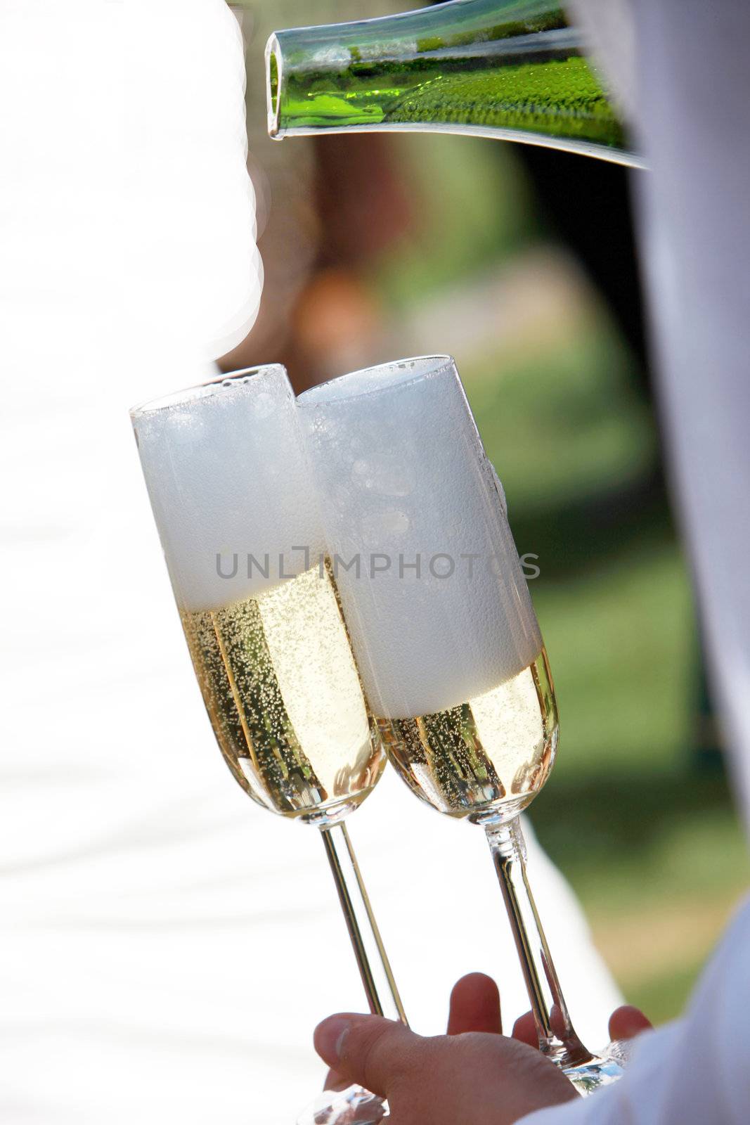 A waiter filled champagne glasses by Farina6000