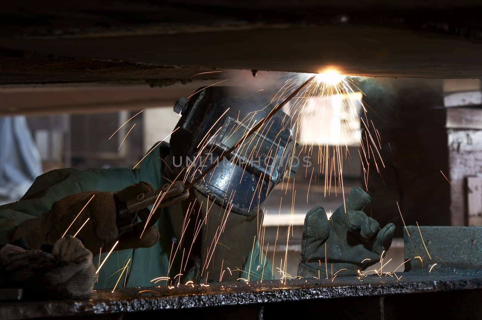 a welder working at shipyard during day