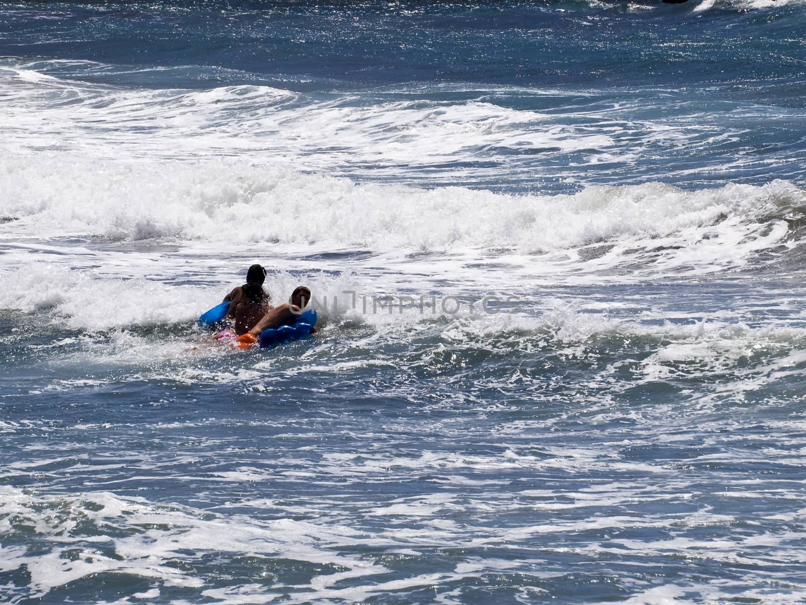 Young adults have fun on the waves