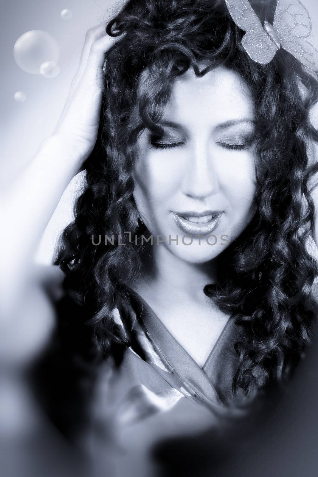 Fantasy? Nirvana? Hallucination? Utopia? Breathless, beautiful model with long locks of hair oozing emotion, blue tonings.