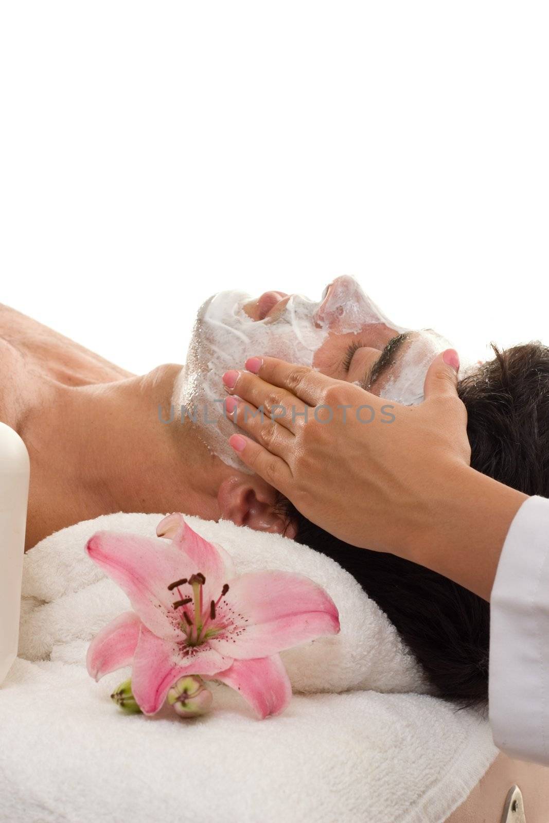 A man escapes the hustle and bustle of urban business life with a de-stressing trreatment at a day spa.   Male patronage at day spas has increased to over 20% of clientelle and this figure rises yearly.   Most popular male treatments are facial, massage, haircut, shave, and body waxing, 