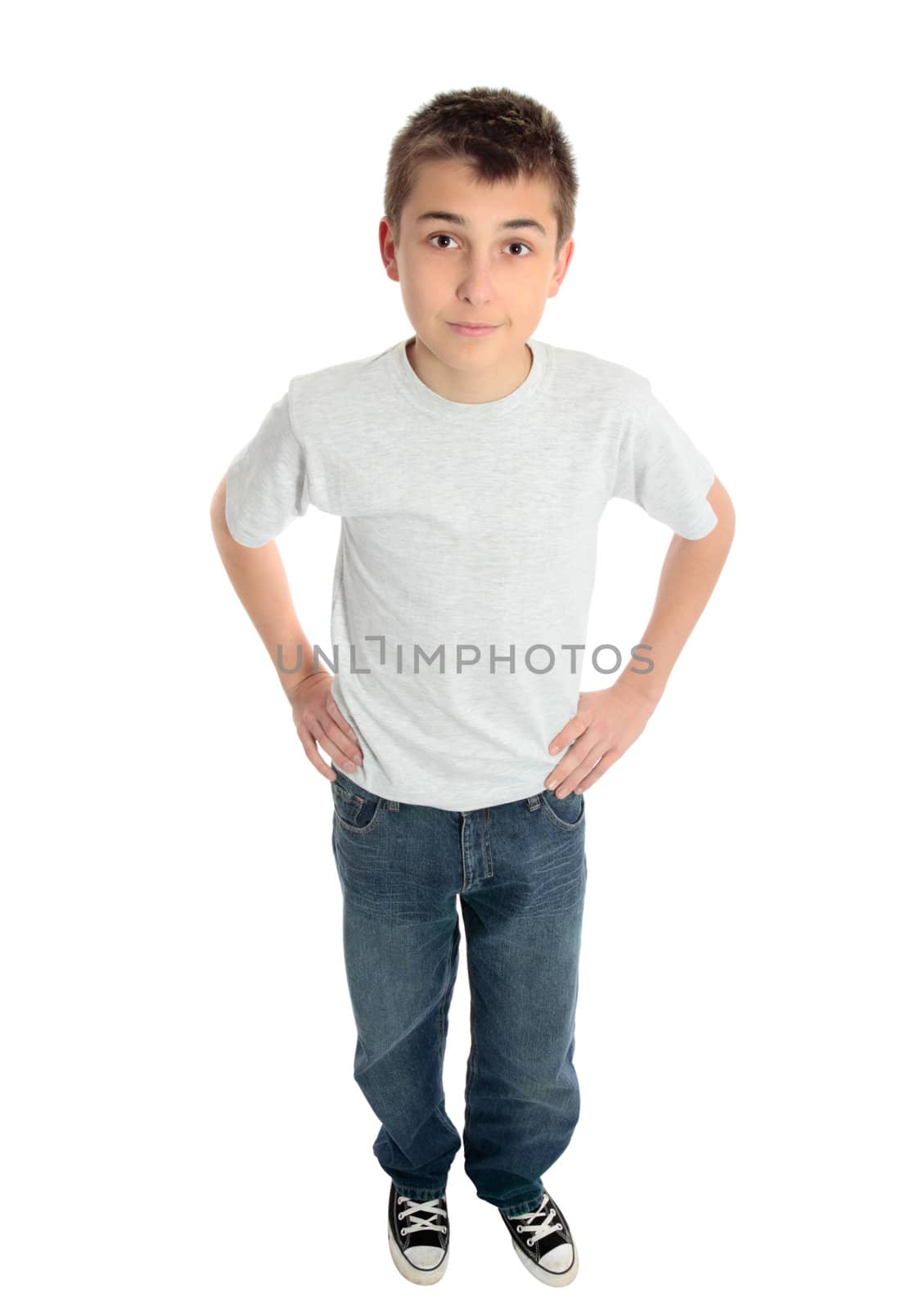 A pre teen child standing with hands on hips
